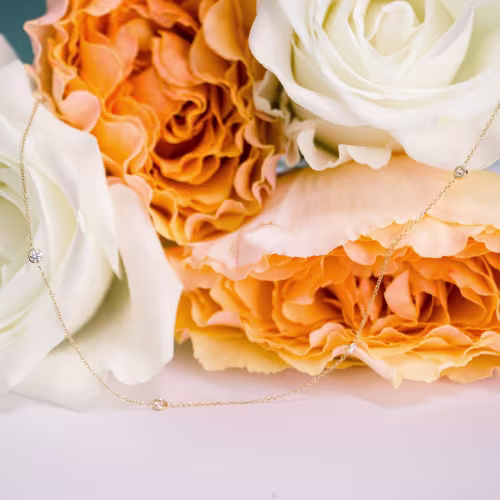 14k yellow gold half carat round five stone lab diamond necklace on model ada diamonds design ad 041