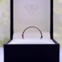 profile view of french u man made diamond half eternity band in 18k white gold