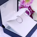 Prong-Set Inside Out Hoop Earrings featuring Exceptional Quality Round Diamonds (Profile View)