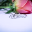 custom three stone emerald pave ring with a 2ct emerald lab diamond and matching french u eternity band