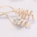oval and baguette three stone engagement ring yellow gold