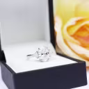 14k white goldl oval and trillion setting featuring 2.25ct oval man made diamond and trillion side stones ada diamonds design