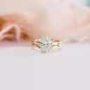 yellow gold wedding set with oval six prong solitaire