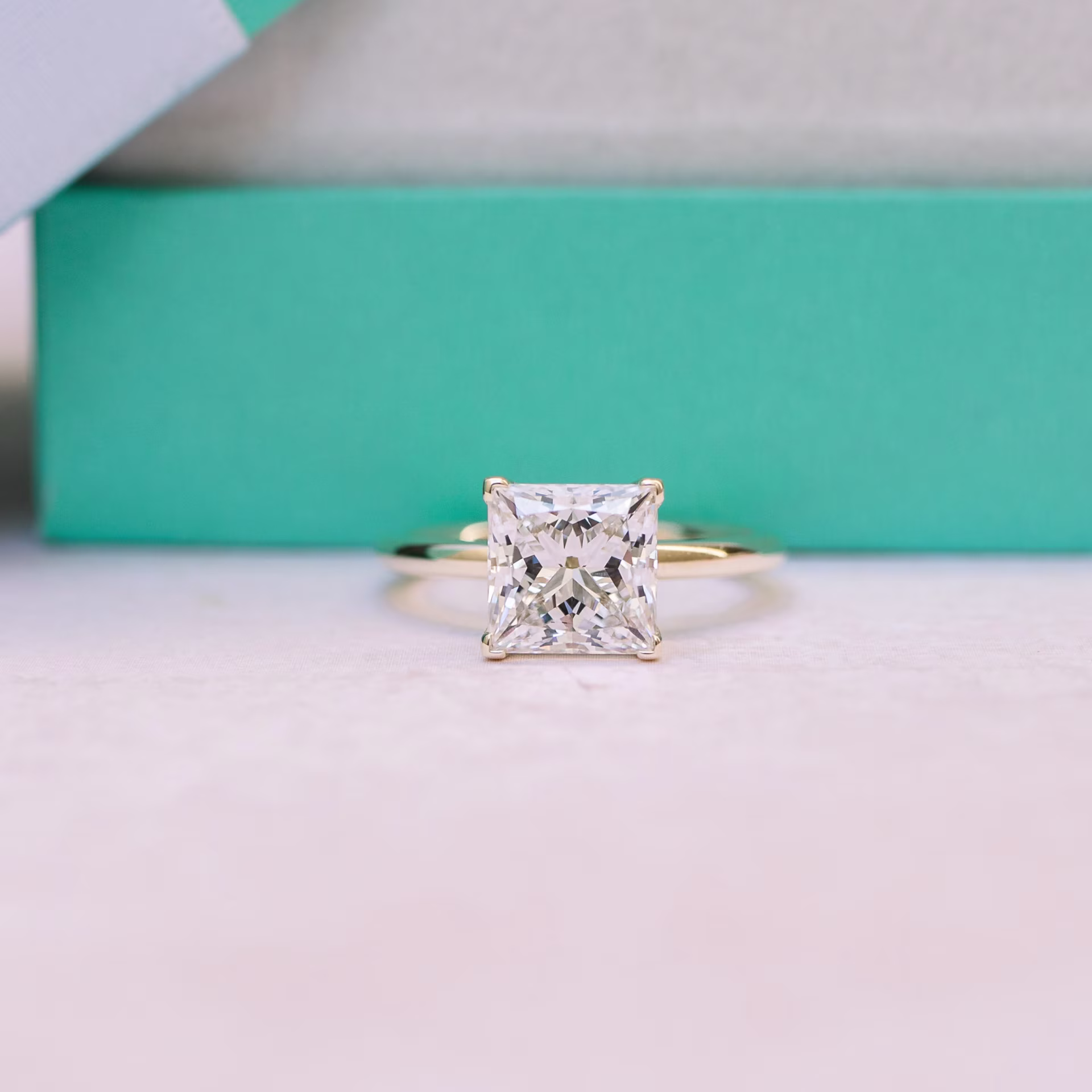yellow gold petite four prong with lab diamond princess cut