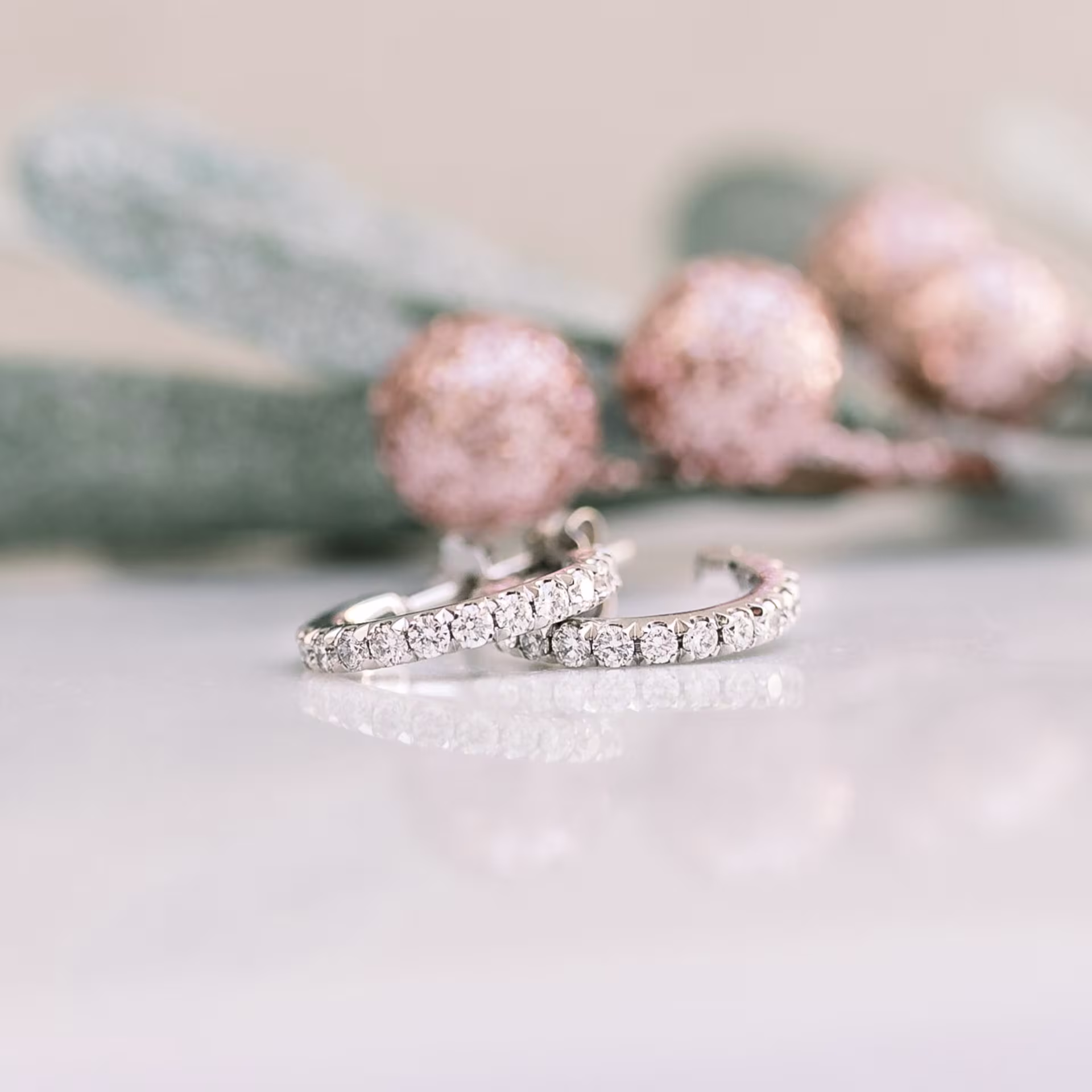 0.63 ct Round Brilliant Diamonds set in 14k White Gold Diamond J Huggie Hoop Earrings (Side View)