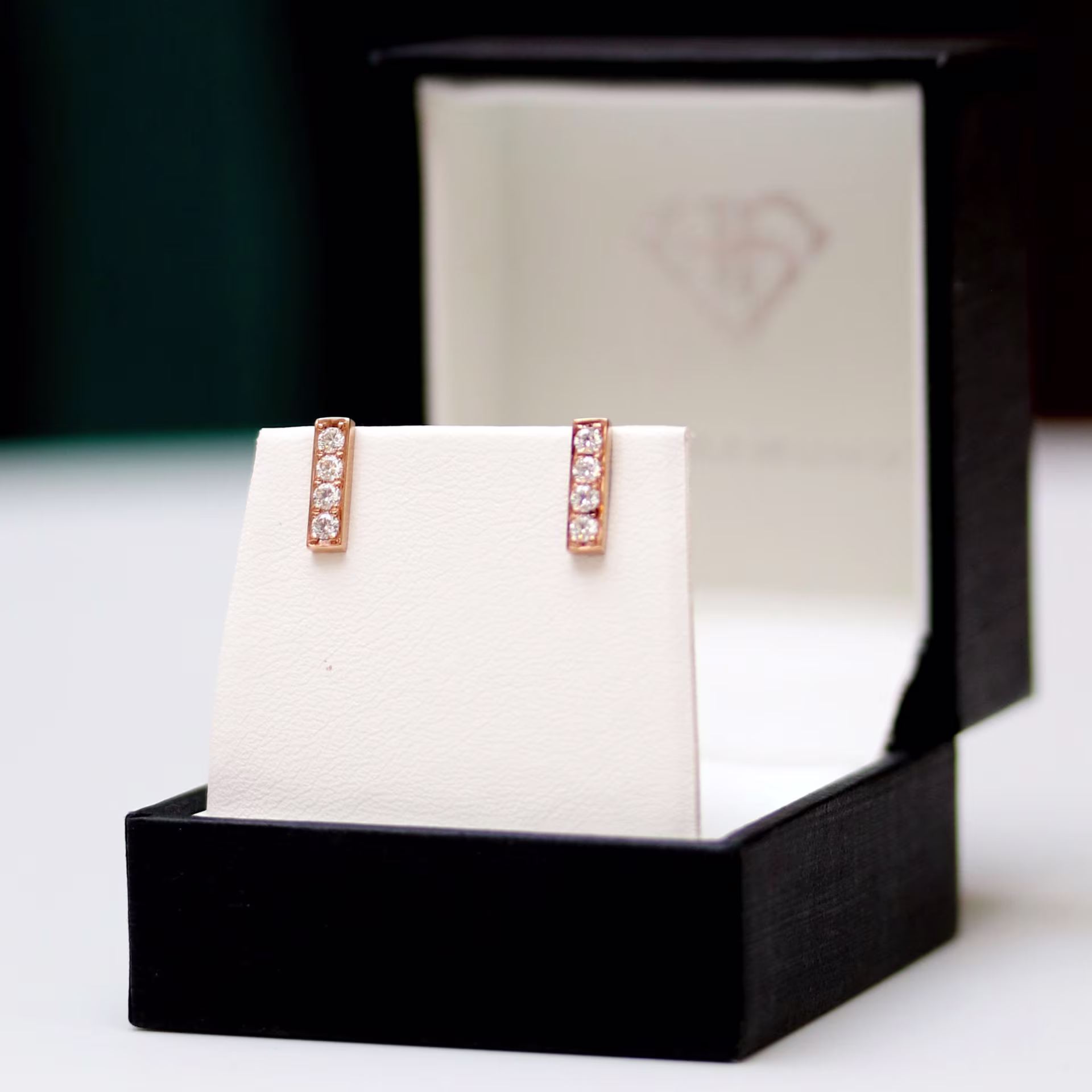 0.24ct rose gold bar earrings