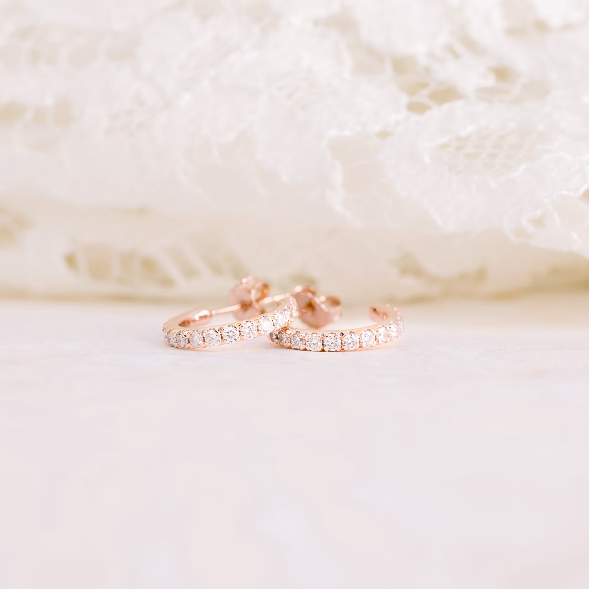 0.63 ctw Round Lab Diamonds set in 14kt Rose Gold Diamond J Huggie Hoop Earrings (Main View)