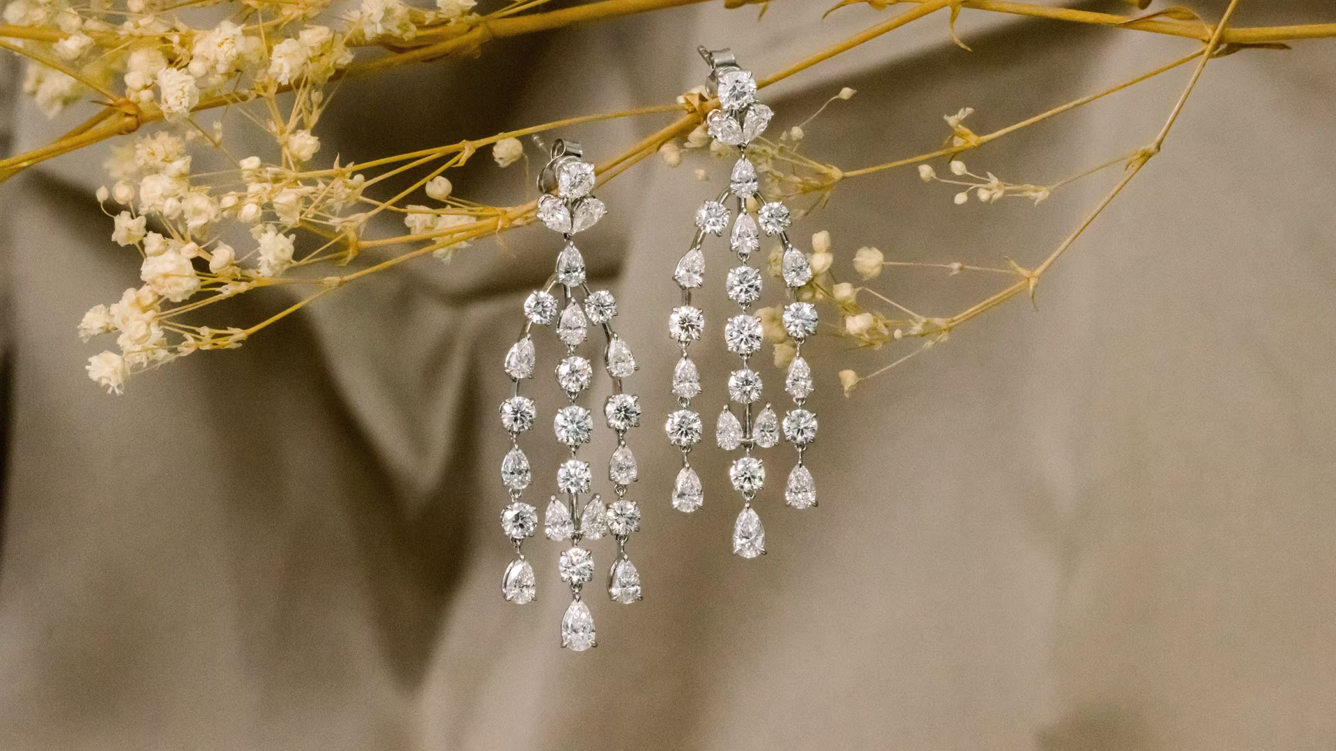 14k white gold round and pear three strand lab diamond earrings