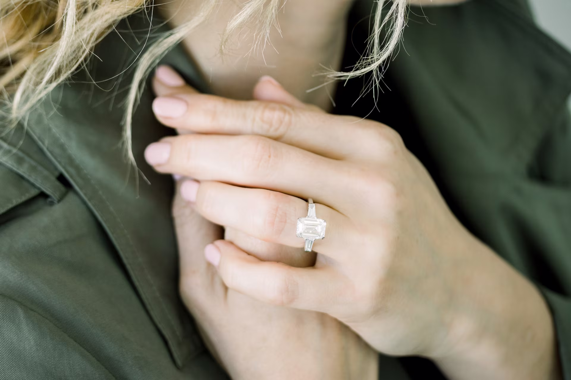 3.5ct emerald and baguette three stone lab diamond ring platinum on model