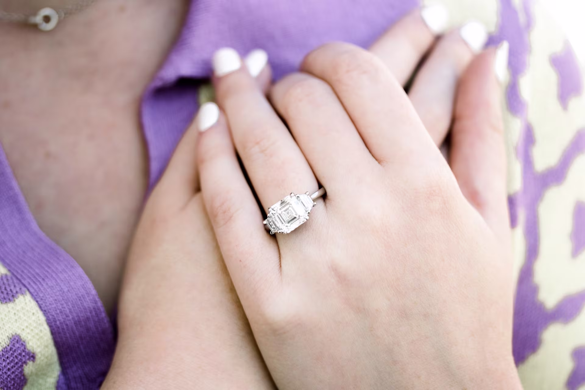 3.5ct asscher and trapezoid three stone platinum on model