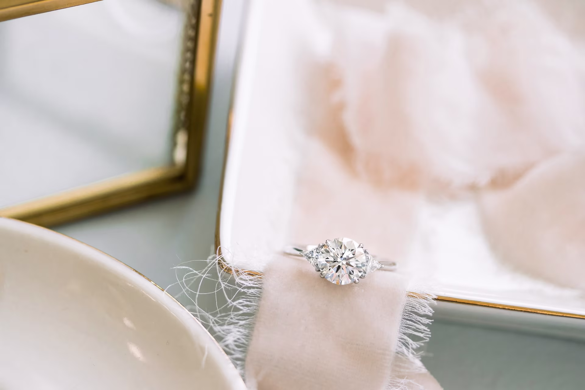 2ct round lab diamond three stone ring with trillion side stones platinum ada diamonds