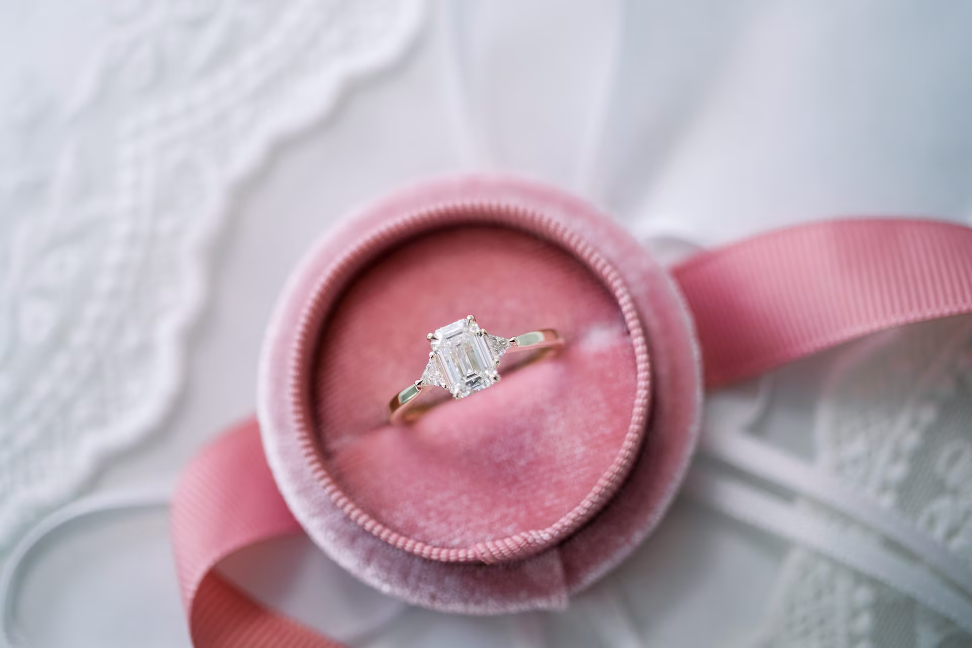 emerald and triangular brilliant three stone lab diamond ring