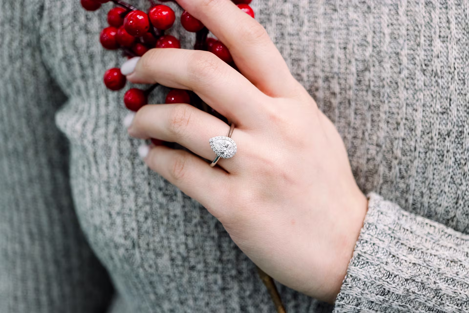 1.25ct pear in halo engagement ring setting