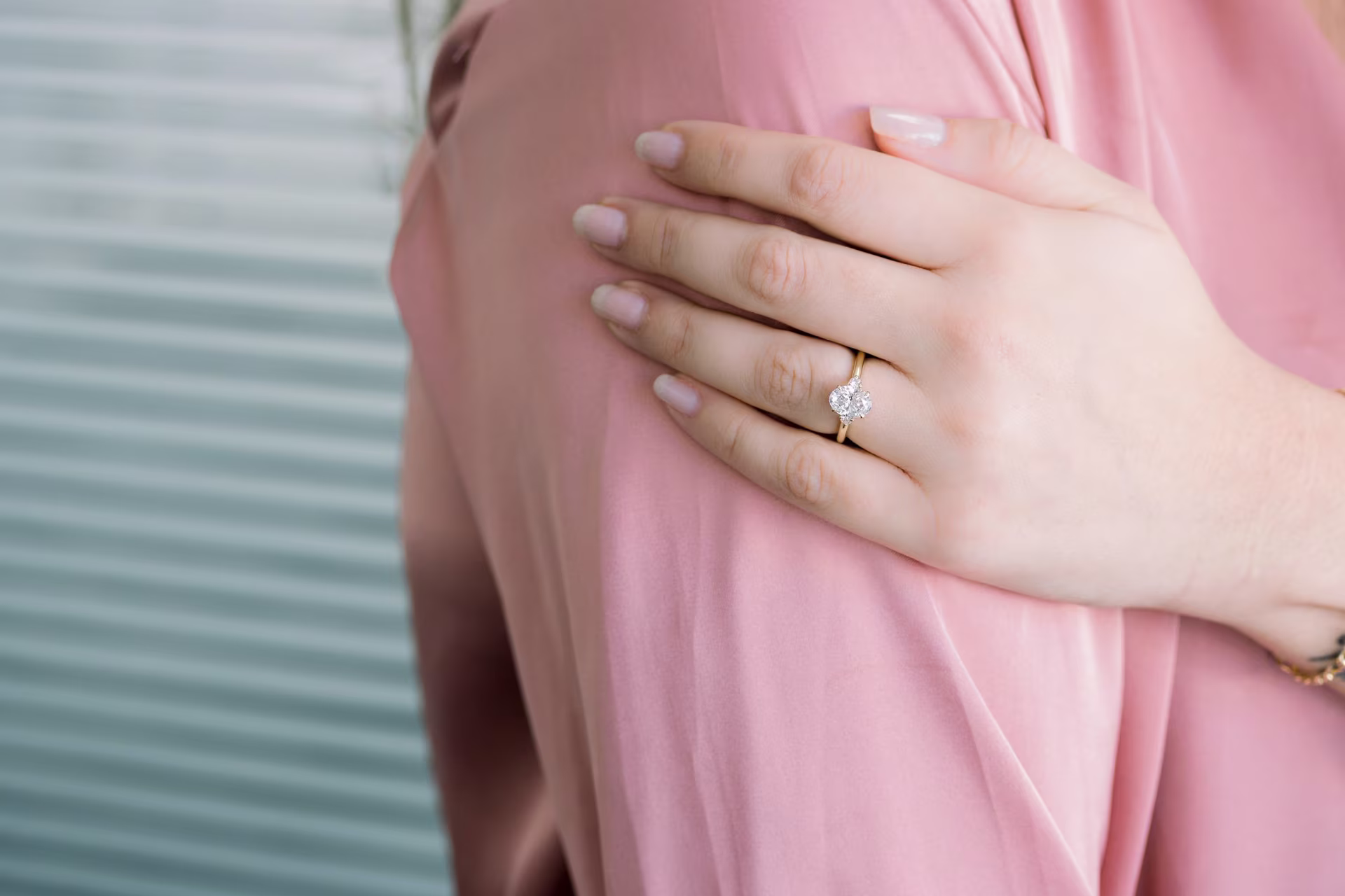lab created three stone ring with oval and round side stones