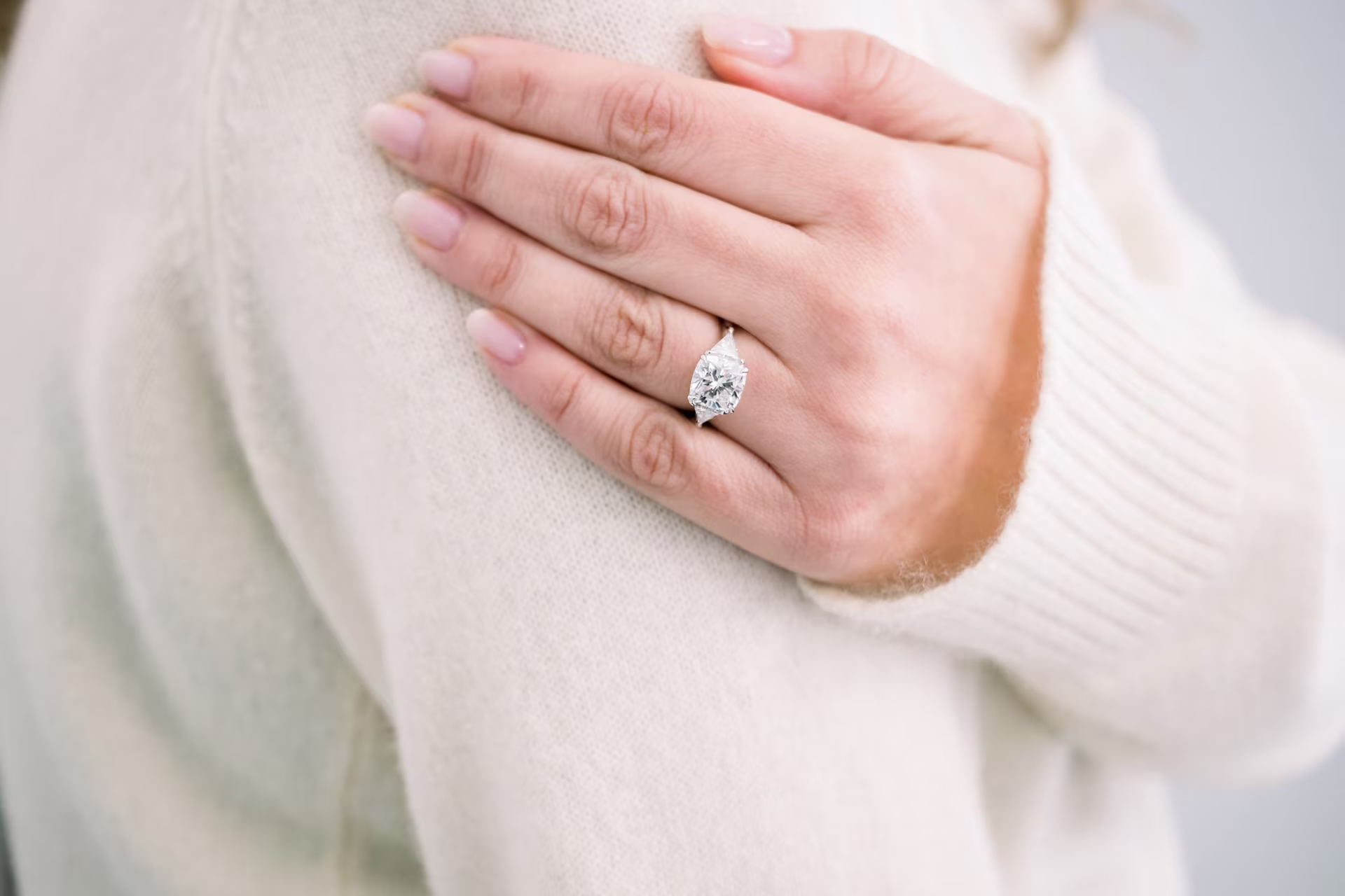 3ct cushion with trililon side stone sin platinum