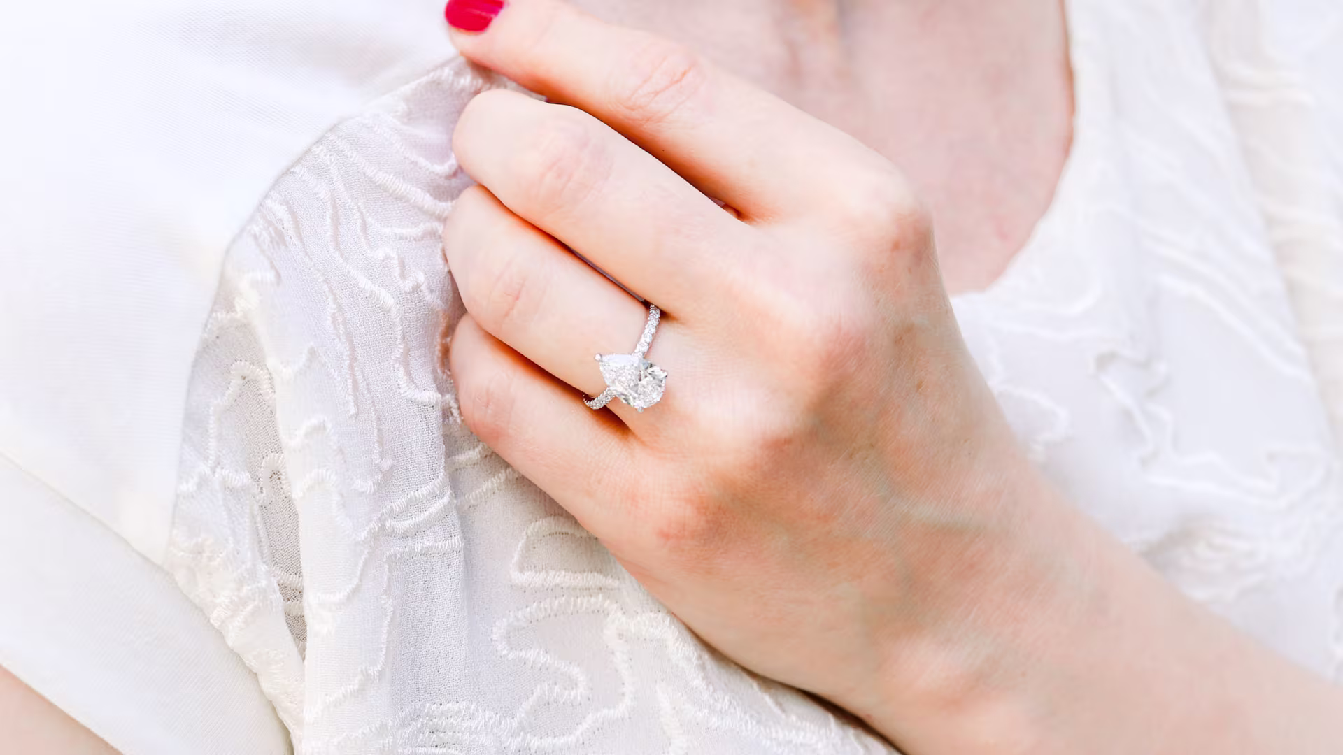 pear lab diamond on model with diamond band ada diamonds