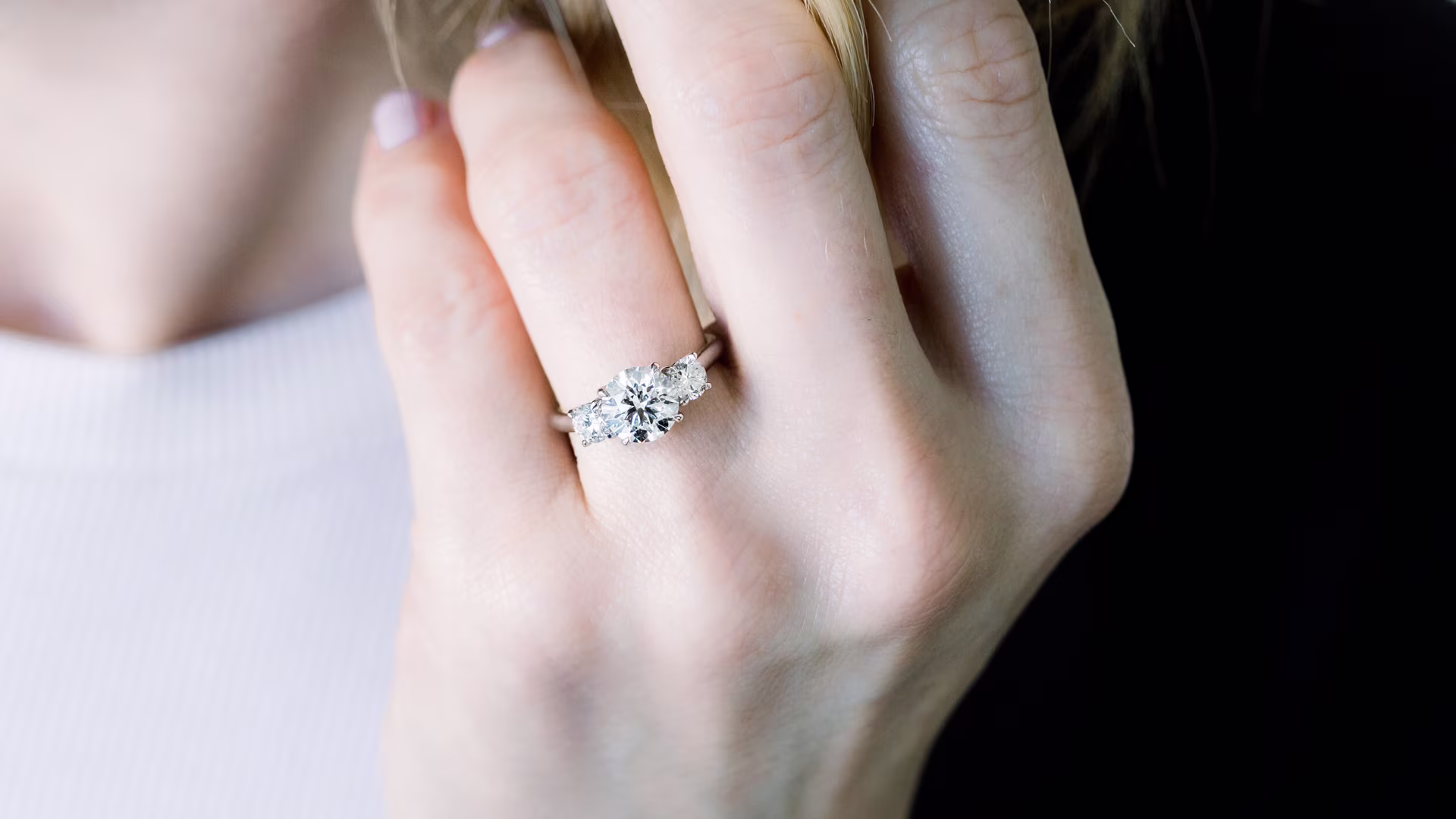 three stone round lab diamond ring in platinuim on model