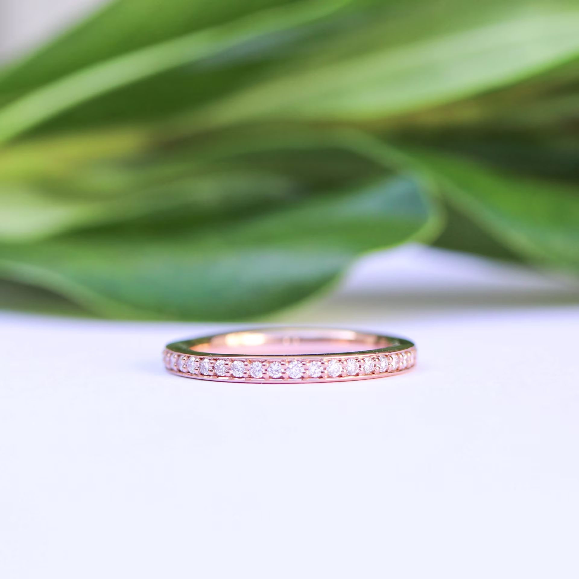 Manmade Diamond Channel Set Half Wedding Band In Rose Gold AD084