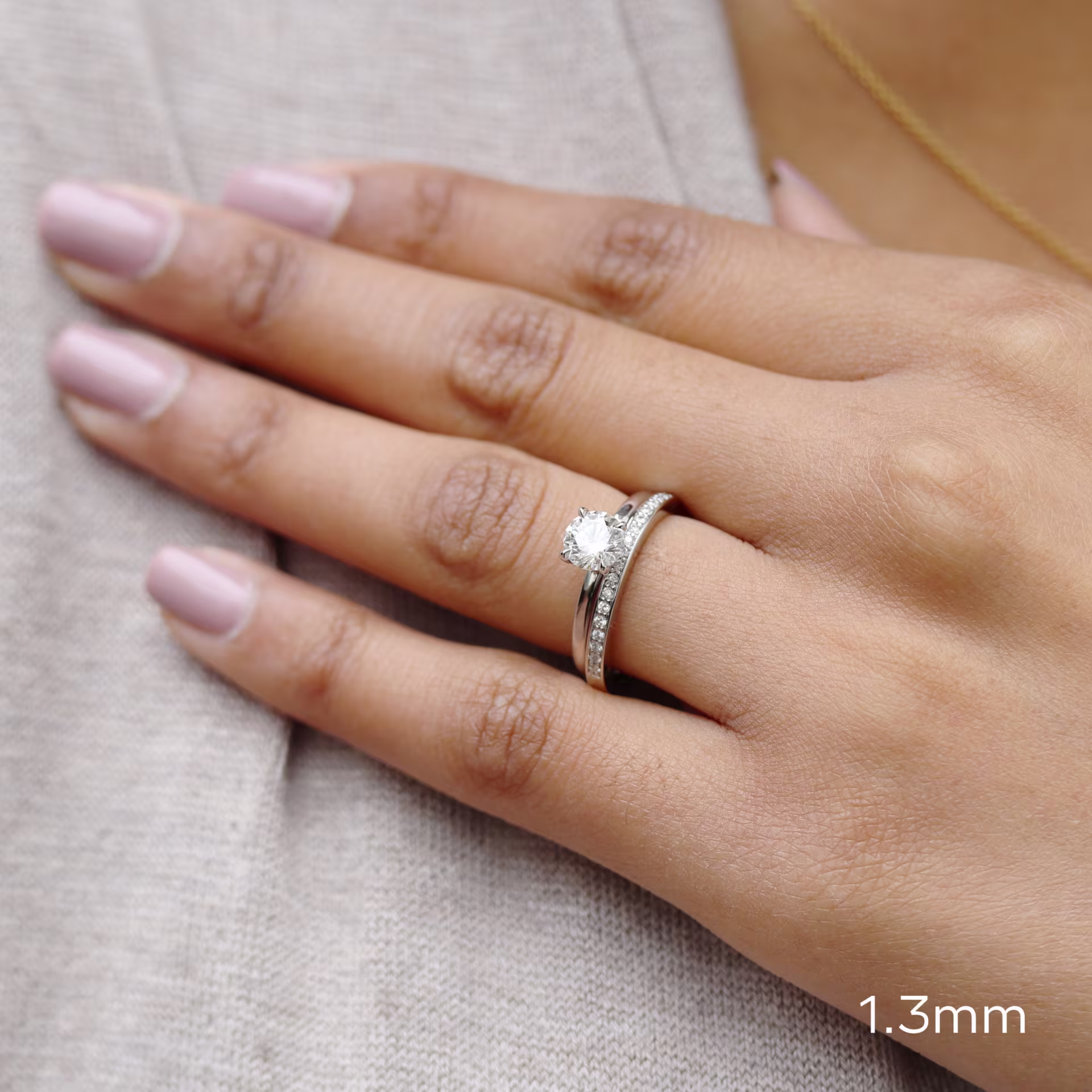 round lab diamond solitaire with channel set half band ada diamonds design ad 084 on model