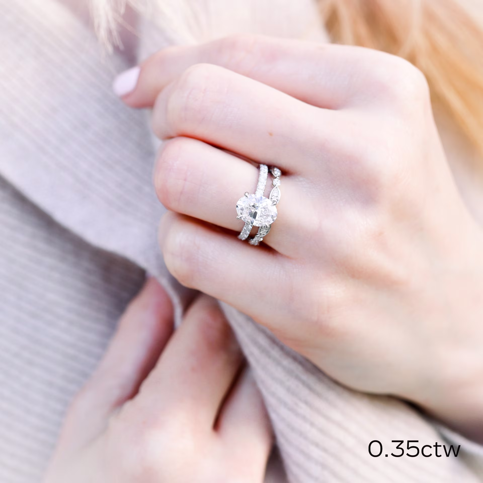 Oval Four Prong Pavé Engagement Ring and Leaf Style 3/4 Eternity Band in Platinum featuring Lab Diamonds Ada Diamonds Design Number AD-216 on Hand