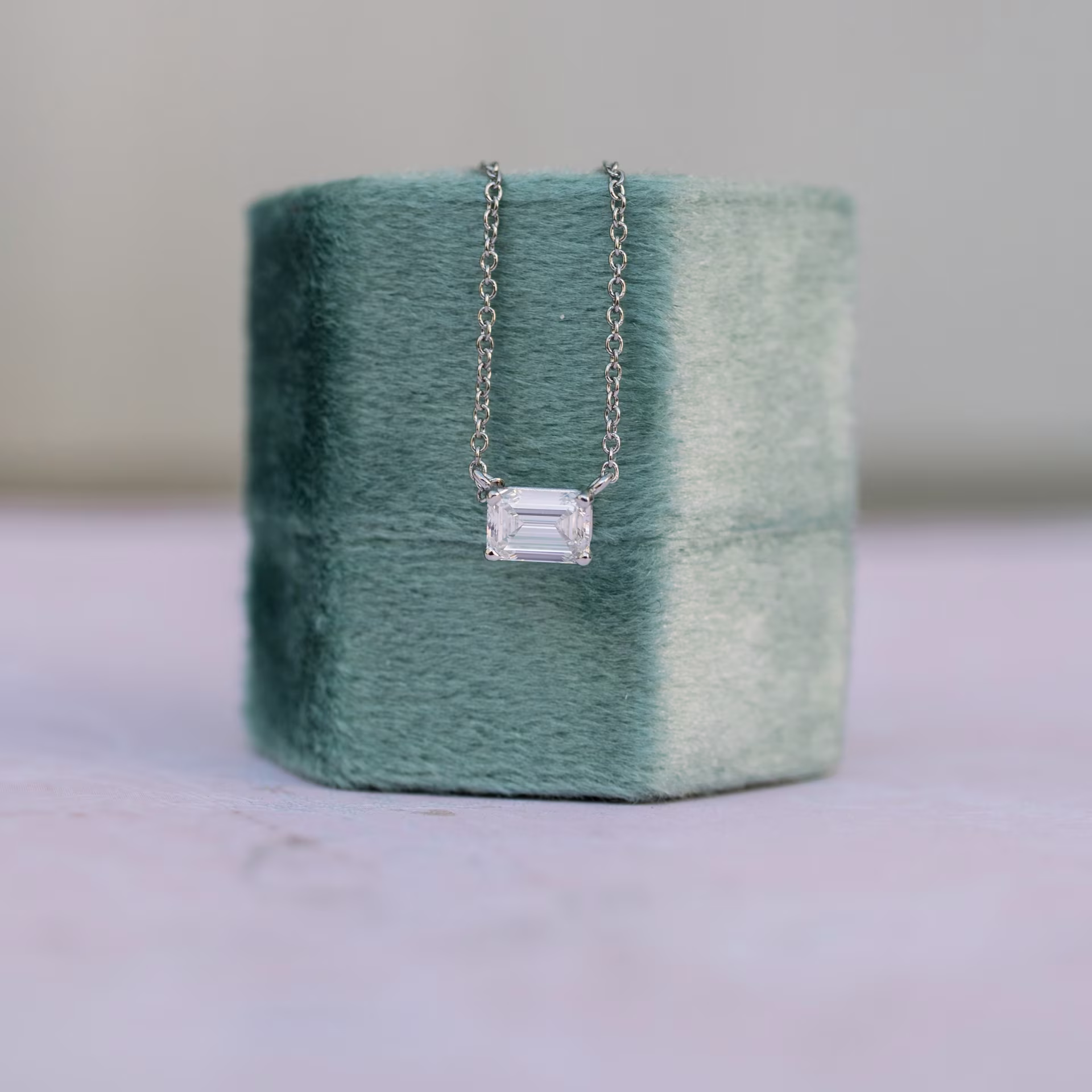 lab grown diamond necklace with east-west emerald cut solitaire white gold