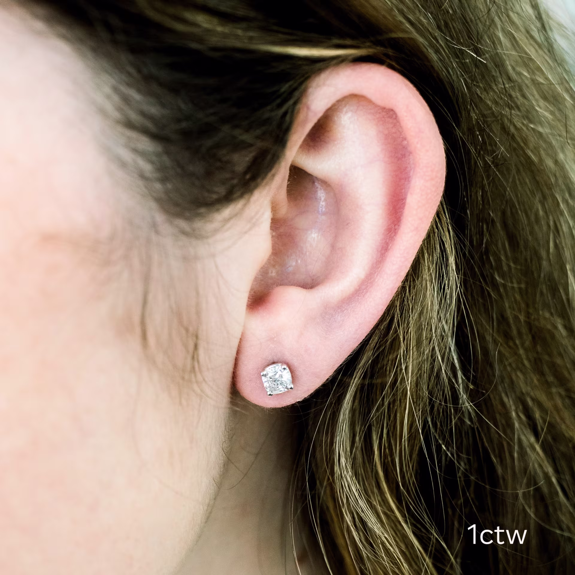 white gold one carat cushion cut stud earrings on model ada diamonds design ad 292