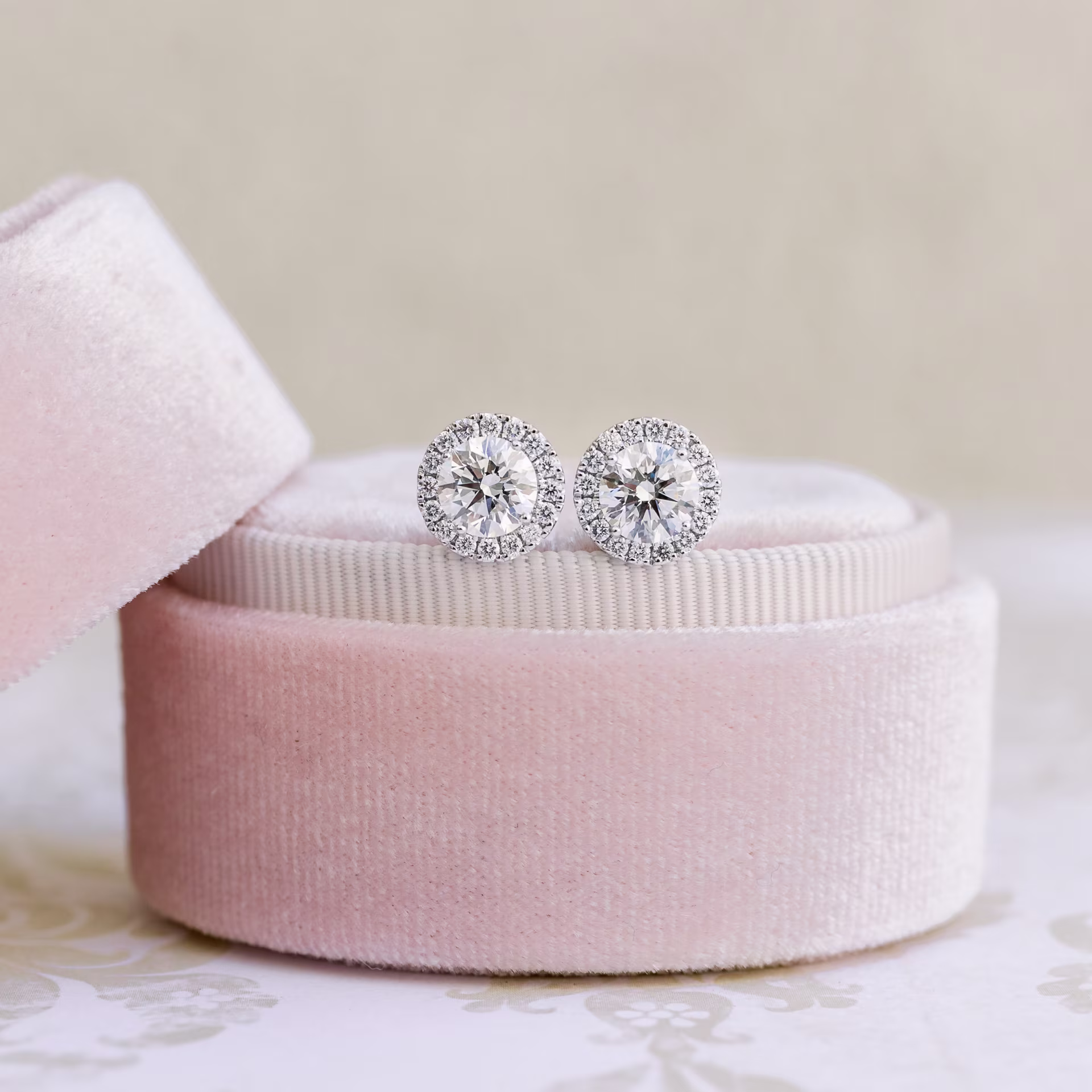 Round Brilliant Diamonds set in White Gold Diamond Single Halo Round Stud Earrings (Main View)