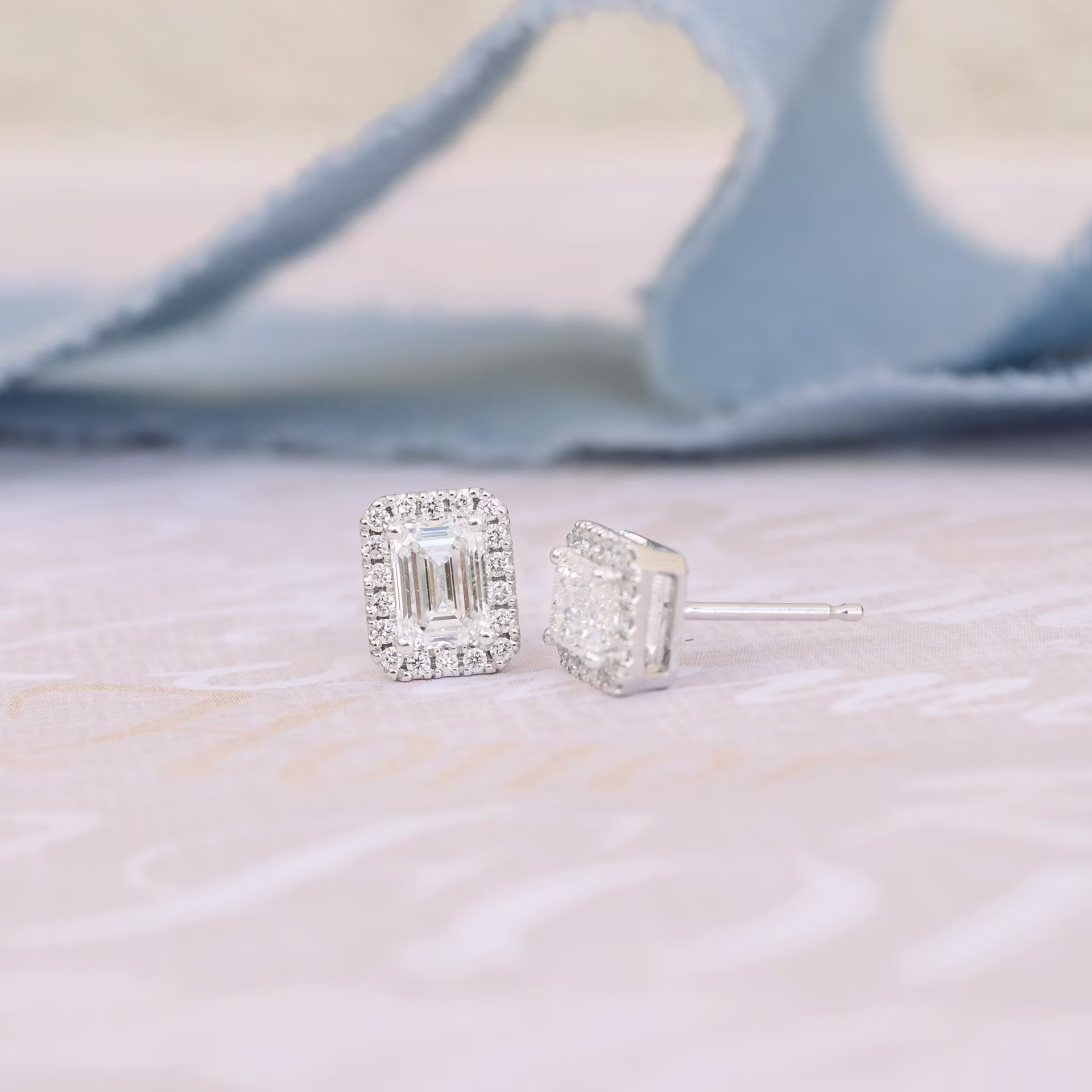 Diamonds set in 14k White Gold Halo Emerald Cut Diamond Stud Earrings (Side View)