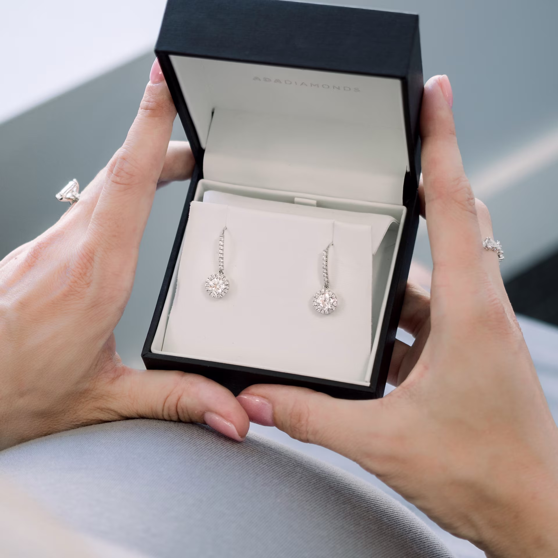 Round Man Made Diamonds set in White Gold Single Halo Round Diamond Drop Earrings (Main View)