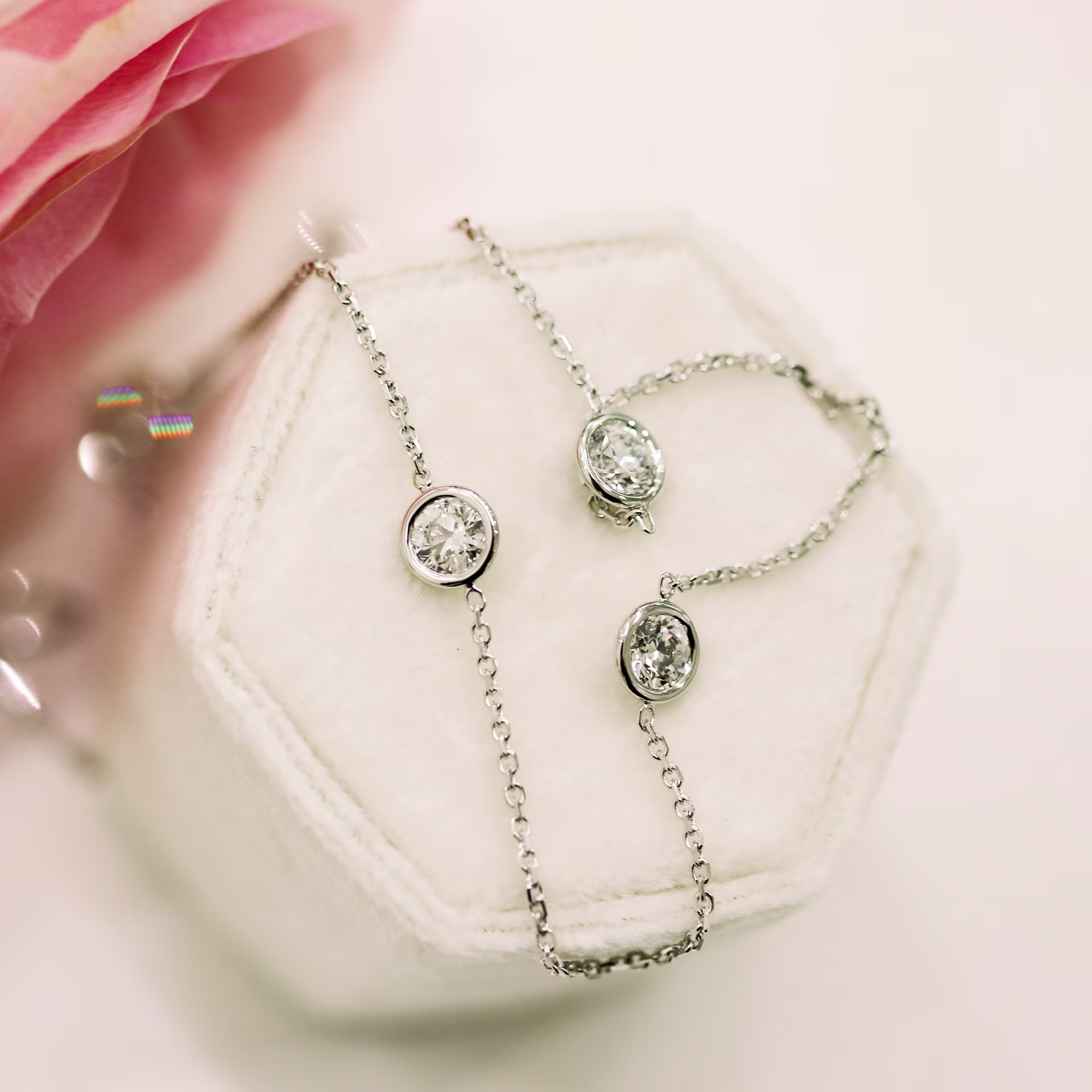 three quarter carat bezel set lab diamond three stone necklace 18k white gold