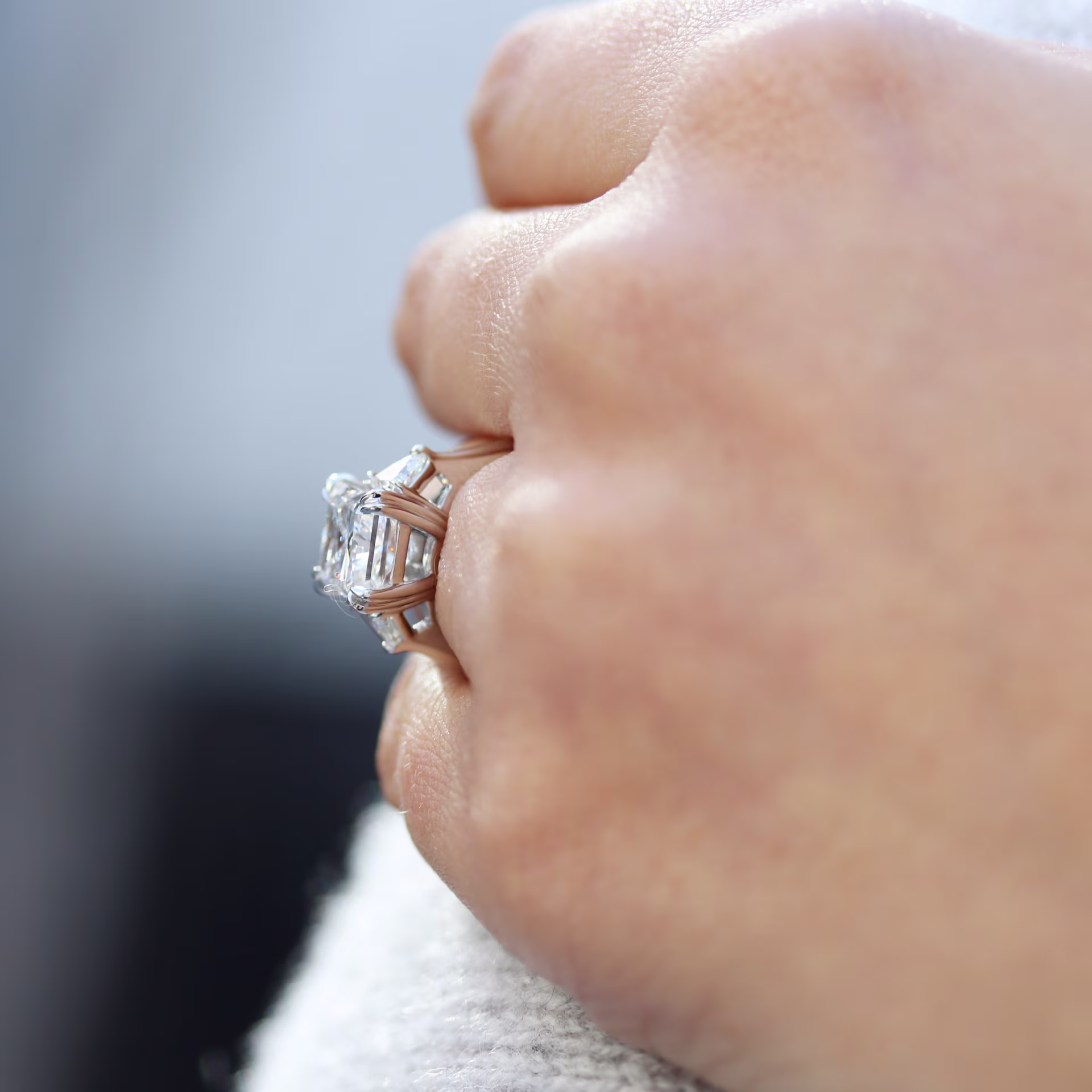 4ct radiant lab grown diamond ring with trillion side stones set in white gold