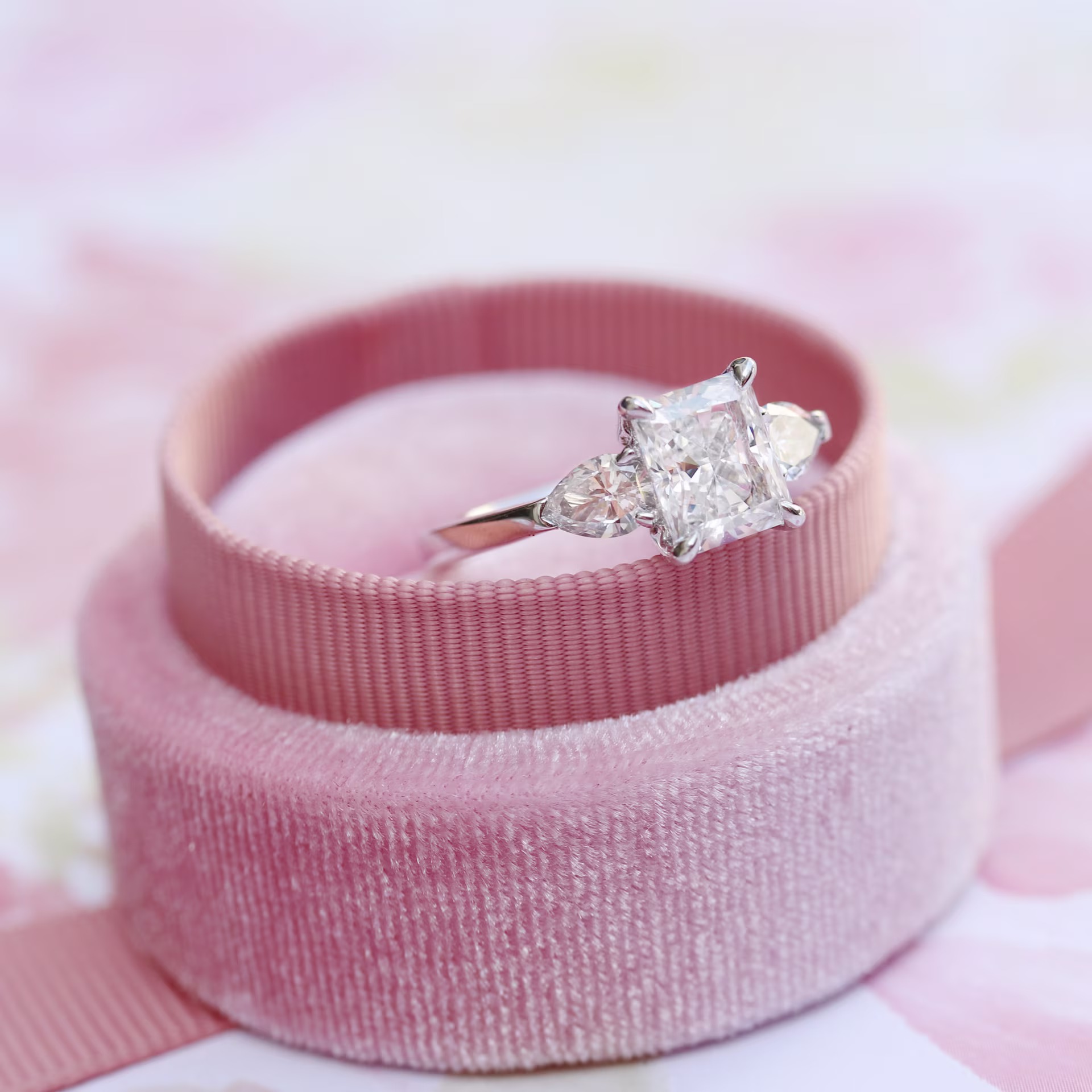 2 ct radiant cut lab diamond with pear side stones set in platinum ring