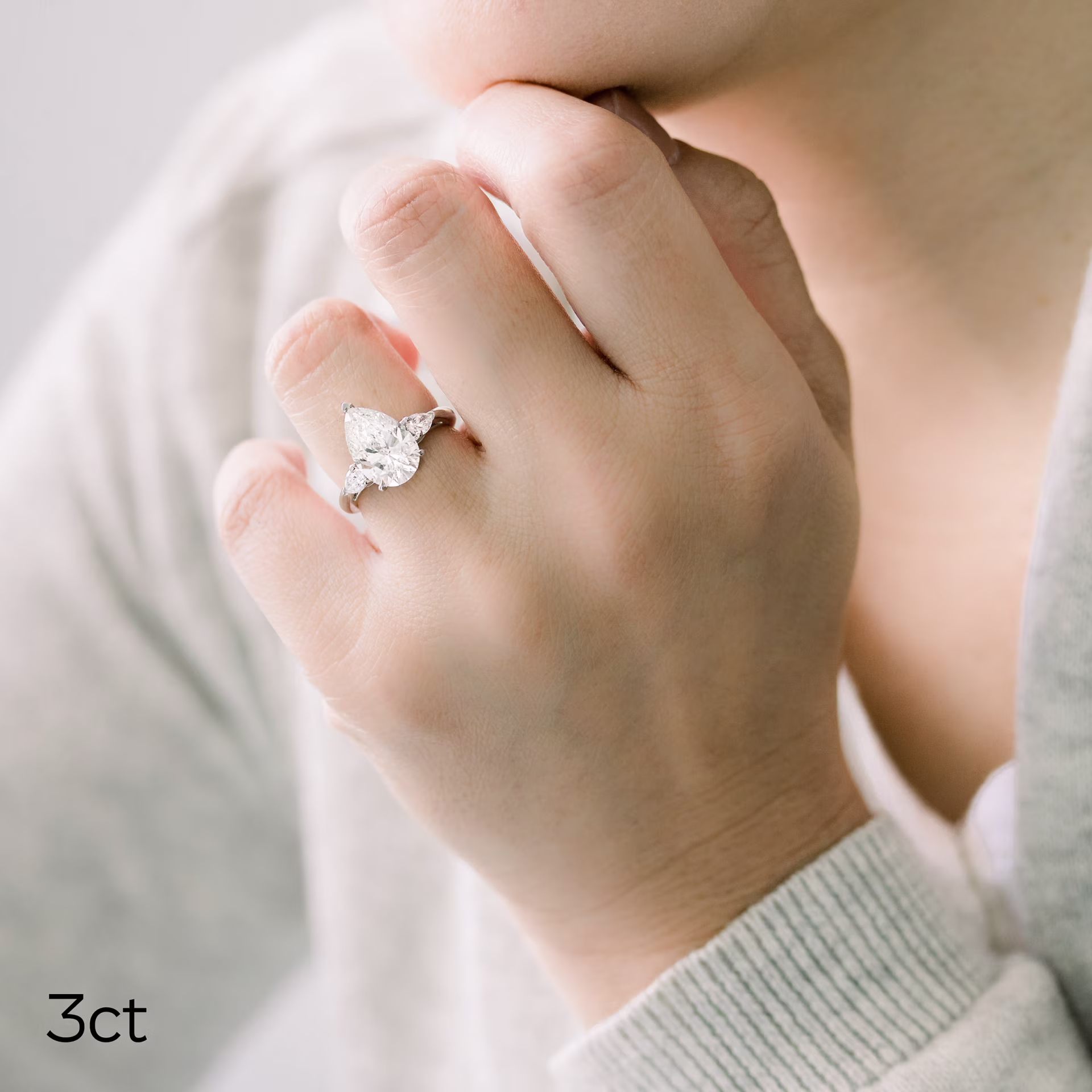 3 ct laboratory gown pear shape diamond ring with pear side stones in a platinum