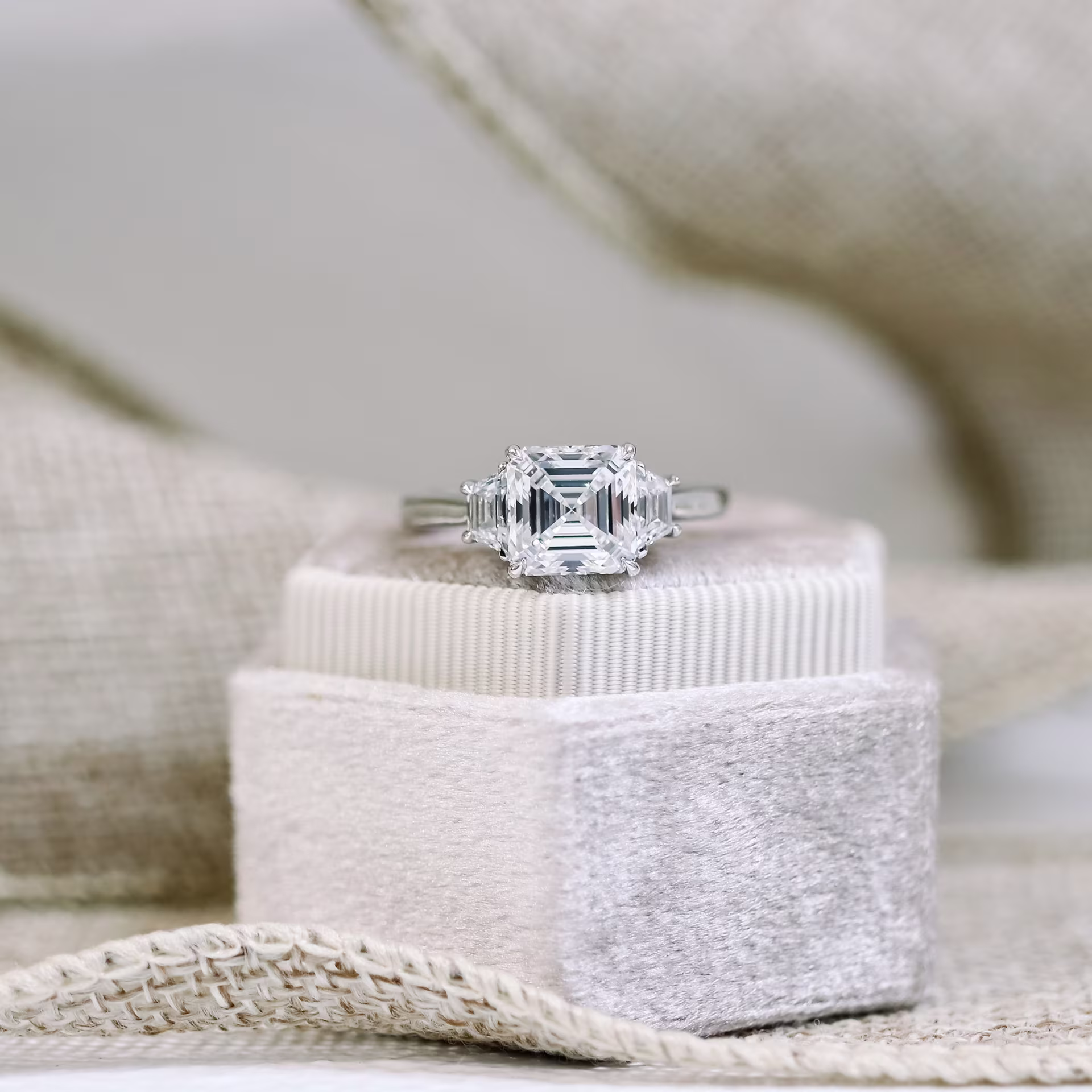2.75ct asscher cut in three stone platinum setting