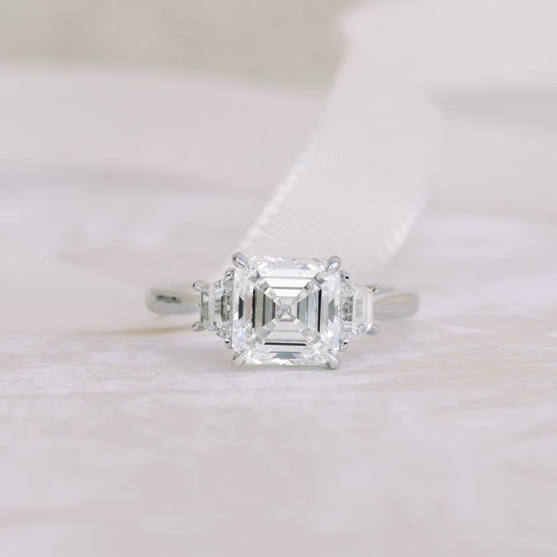 Platinum 2 Carat Asscher Cut Manmade Diamond Ring with Trapezoid Side Stones Ada Diamonds Design AD-494 Macro