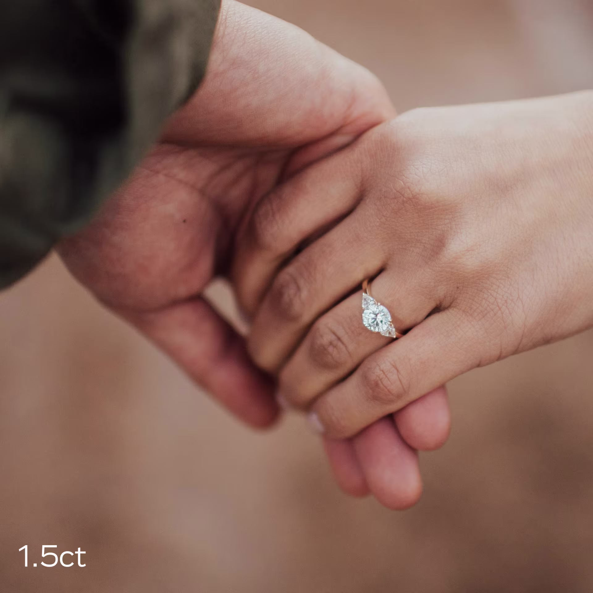 1.5ct round lab diamond with trillion side stones in yellow gold