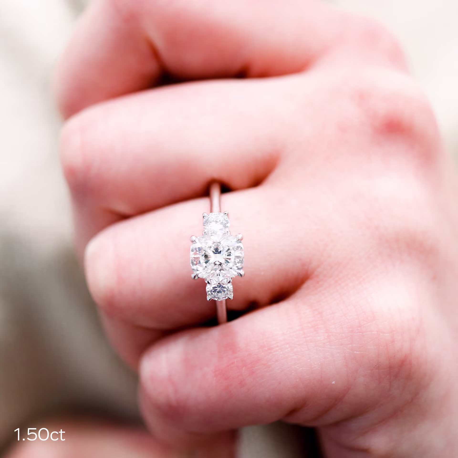 1.5ct lab grown cushion diamond with round side stones in 14k yellow gold ring