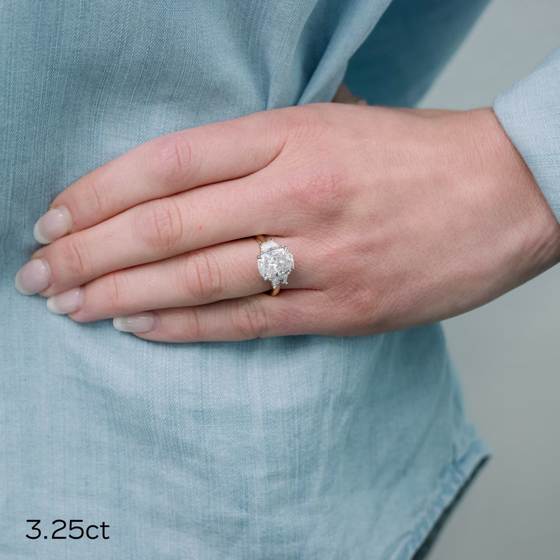 two tone platinum and yellow gold 3.75ct cushion cut and trapezoid three stone lab diamond engagement ring ada diamonds design ad 475 on model