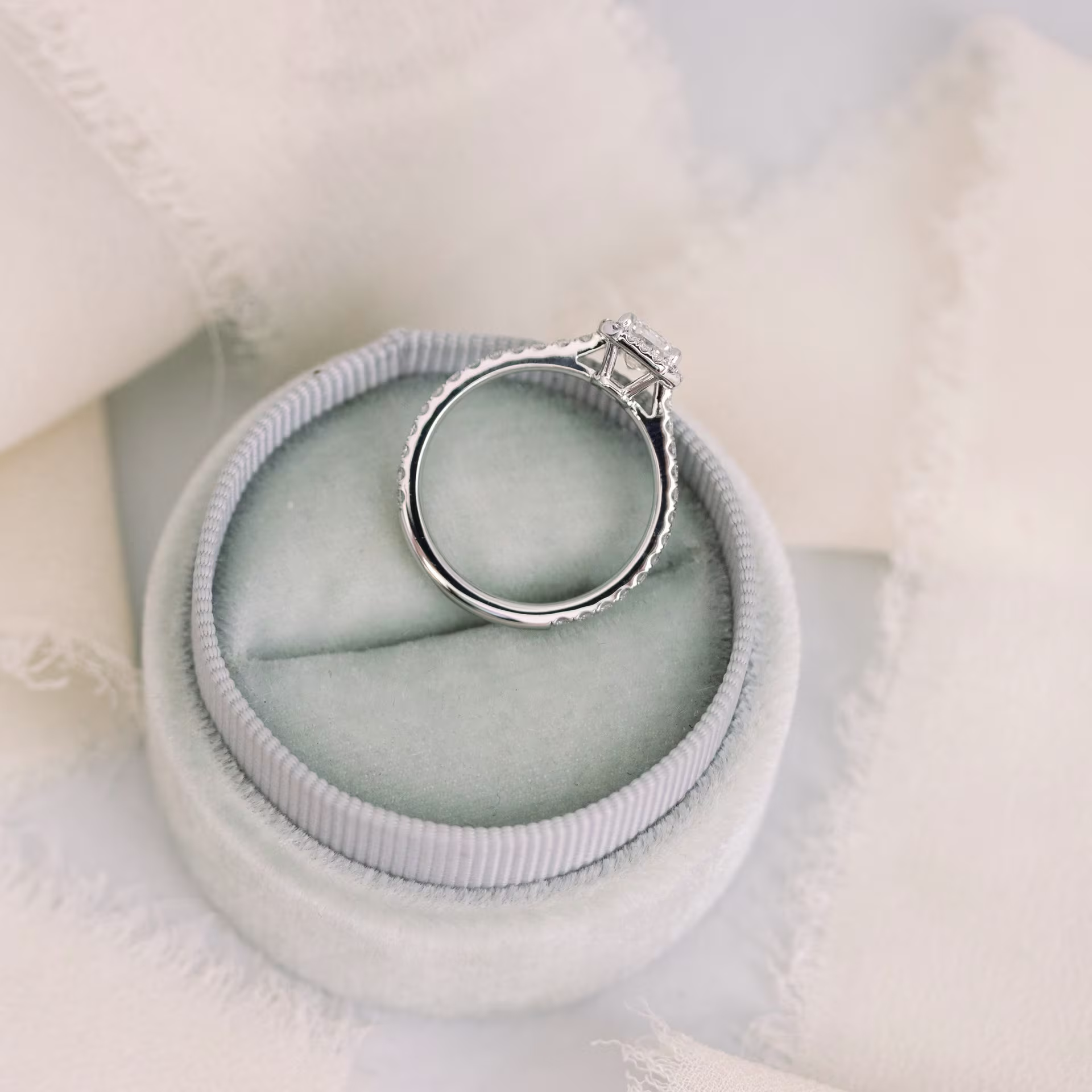 Platinum Emerald Halo Pavé Diamond Engagement Ring featuring 1.25 Carat Synthetic Diamonds (Profile View)