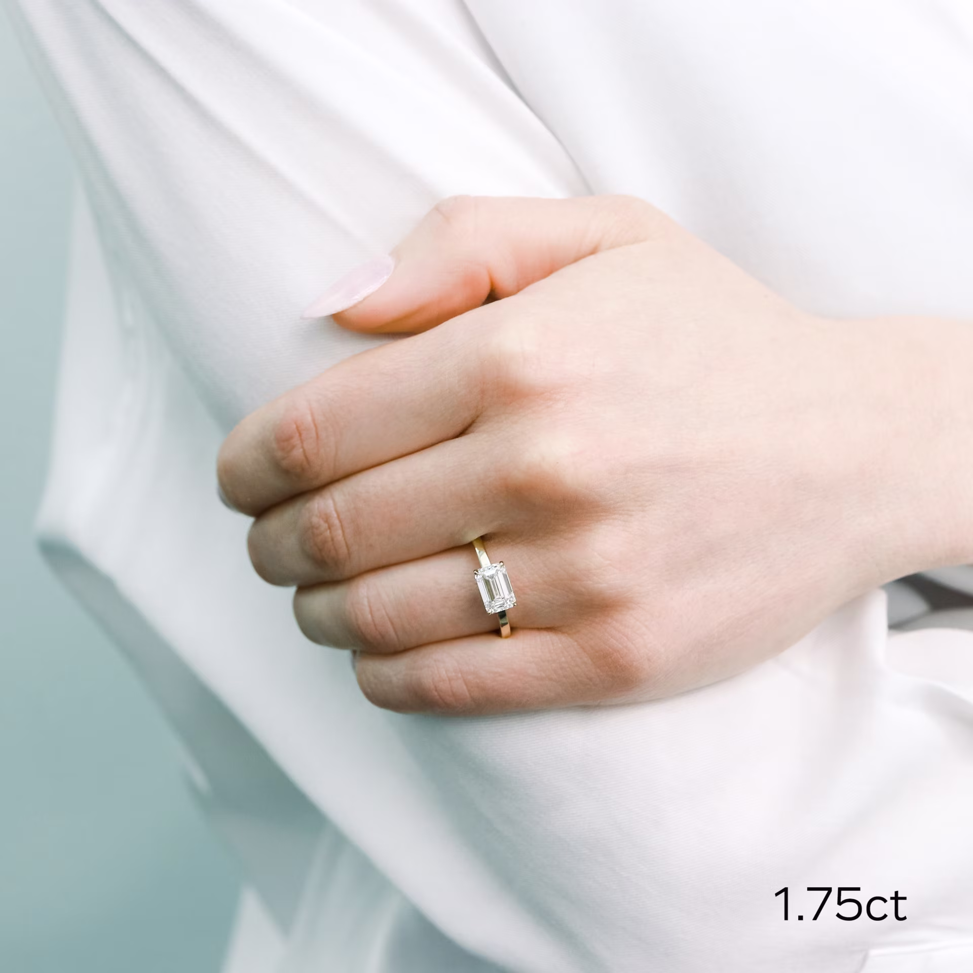 18k yellow gold 1.75 ct emerald cut east-west solitaire engagement ring with lab diamond ada diamonds design ad 337 on model