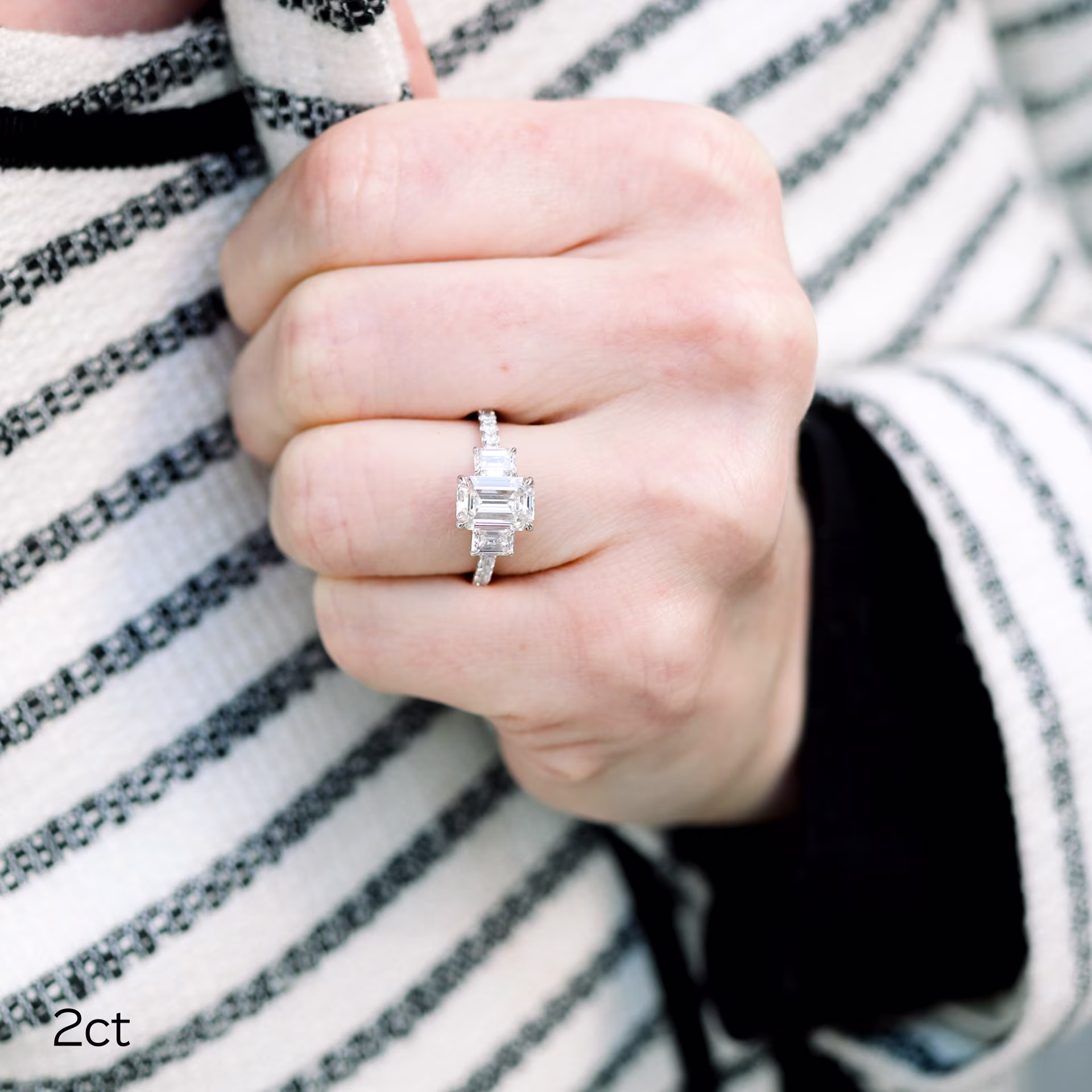 platinum emerald three stone pave ring with 2ct laboratory grown emerald diamond and emerald side stone