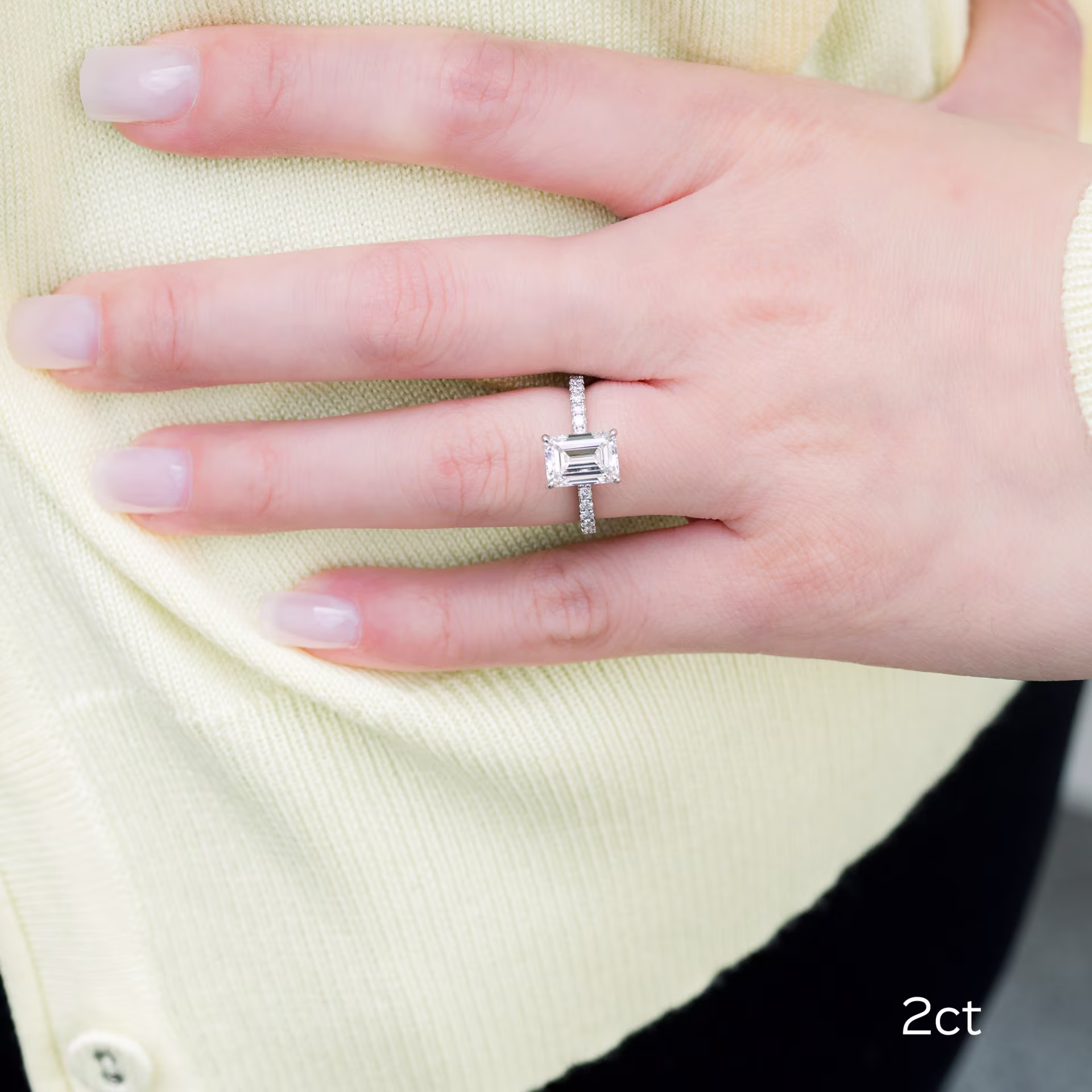 Platinum 2 Carat Emerald Cut Lab Diamond Ring with Diamonds on the Band Ada Diamonds Design AD-152 on Model