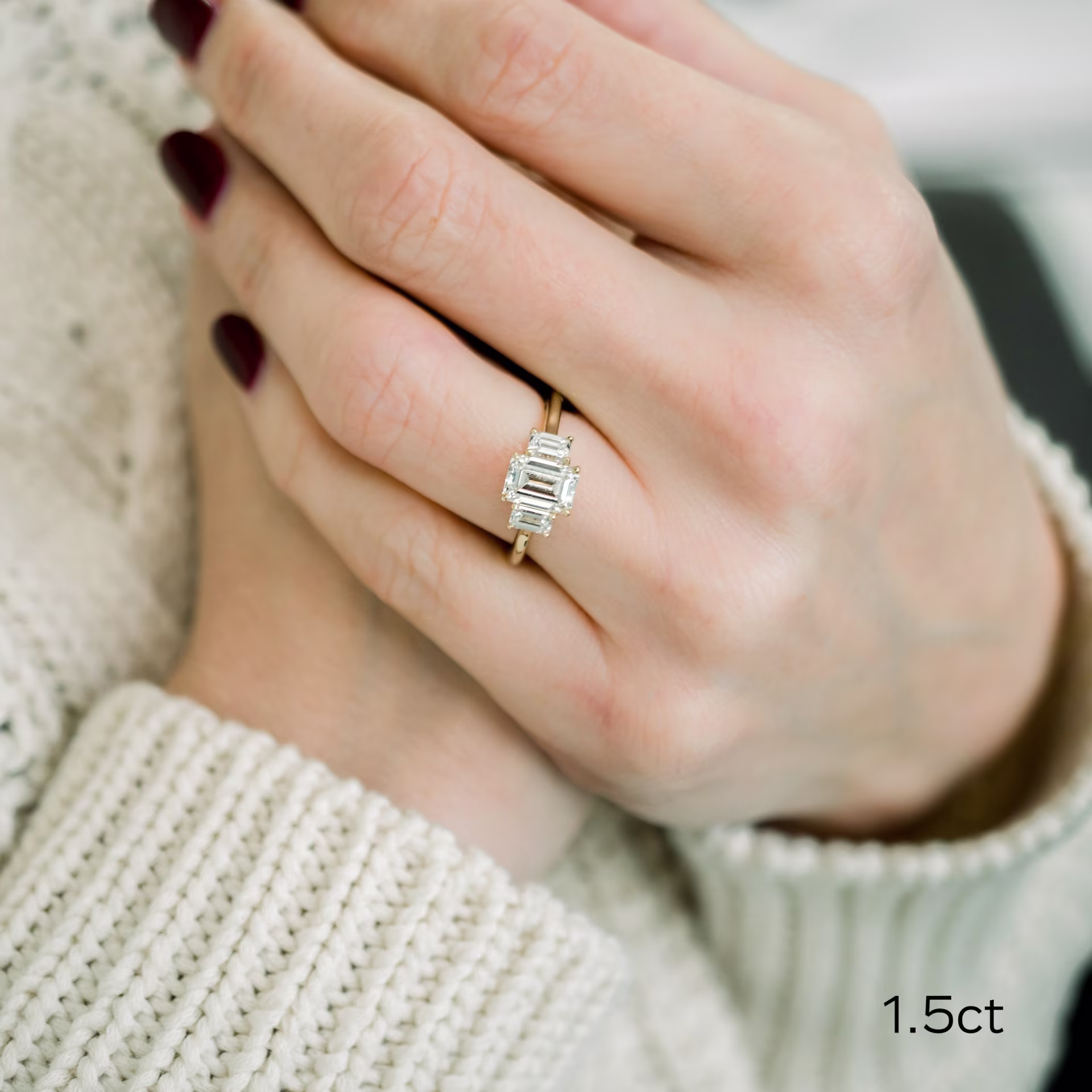 1.5ct emerald cut in yellow gold three stone