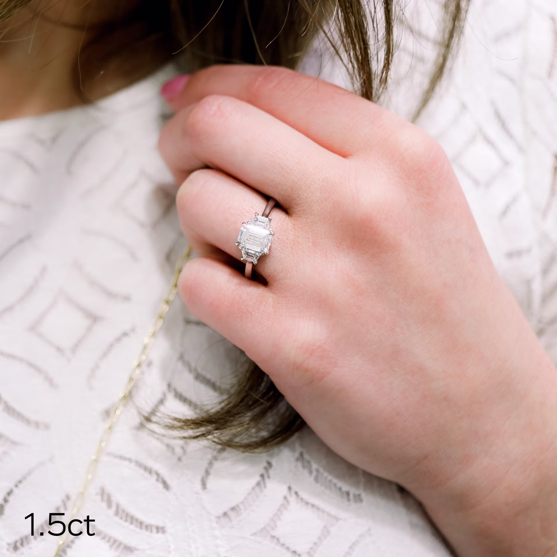 1.5ct lab grown emerald cut diamond and trapezoid side stones