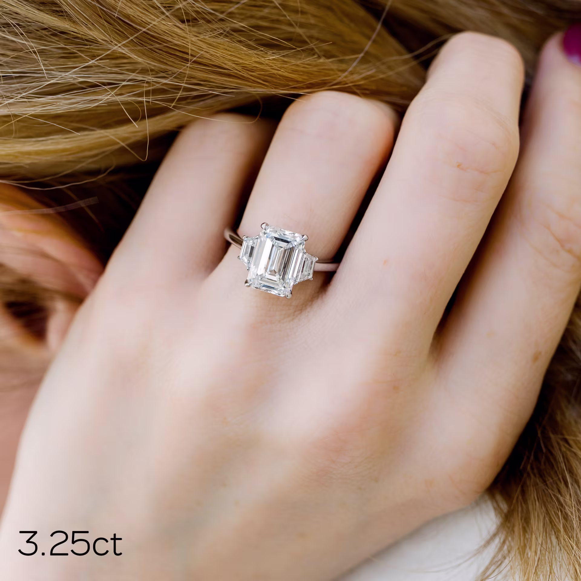 3.25ct emerald cut in trapezoid setting