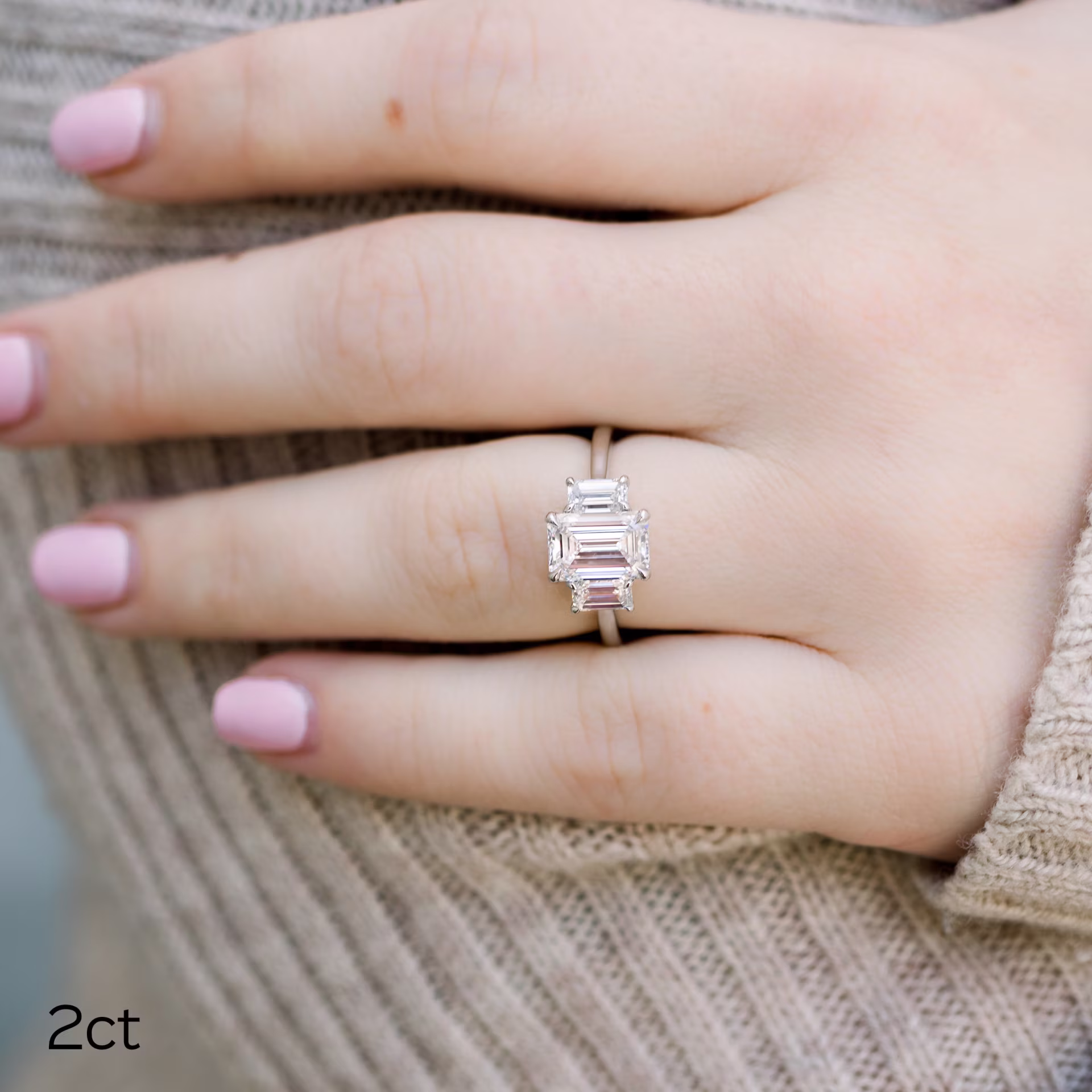 2ct emerald cut in three stone ring
