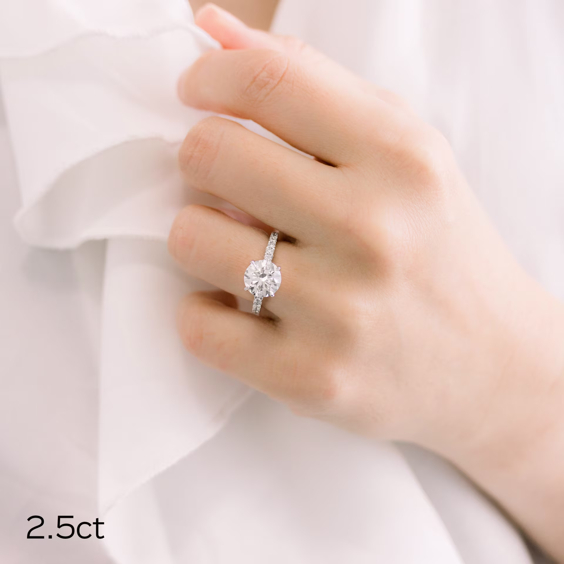 2.5ct round lab diamond in pave setting