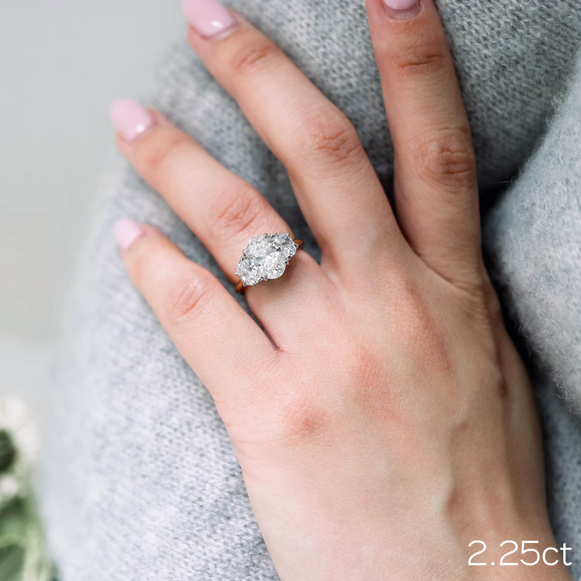 2.25ct oval with half moon side stones in lab diamond engagement ring setting