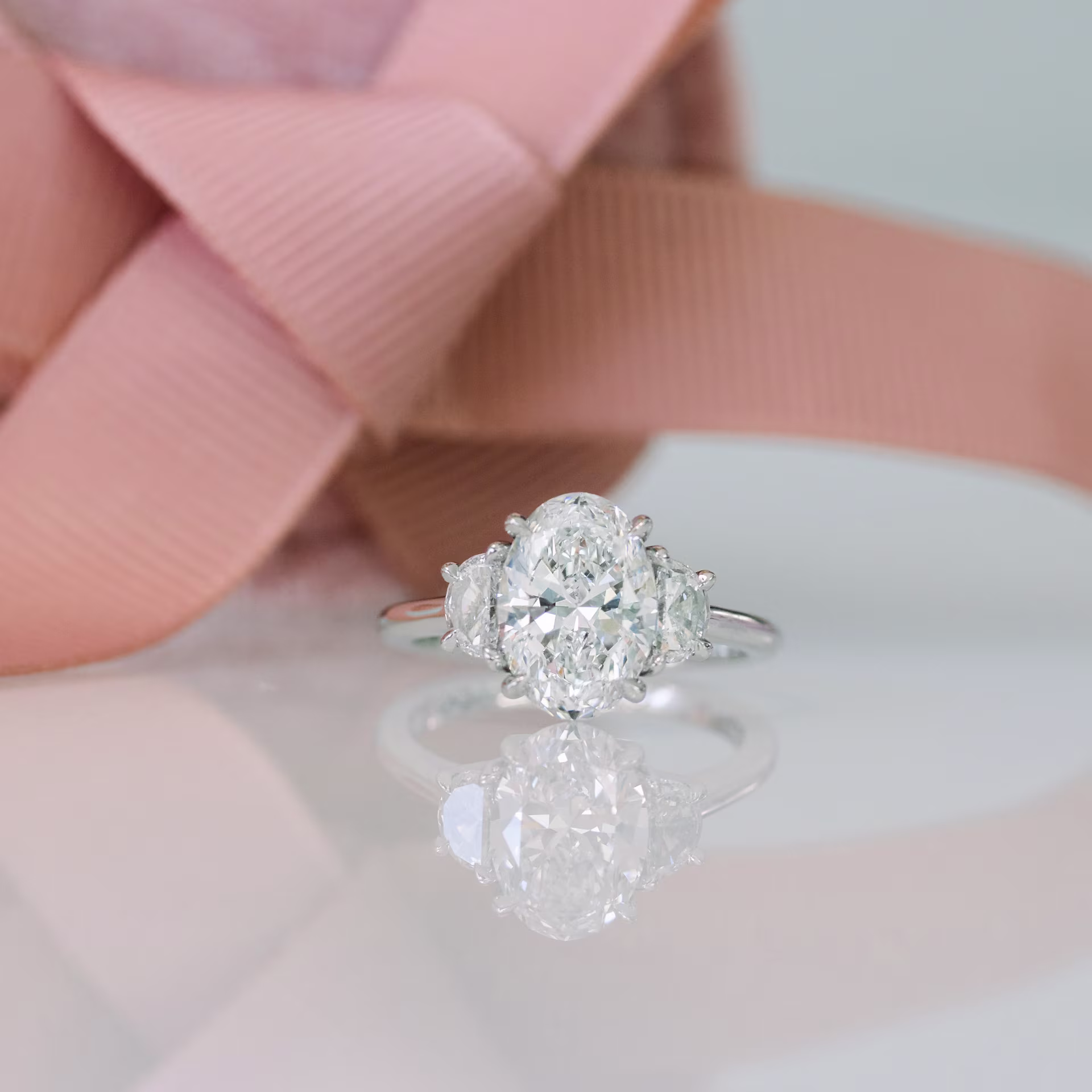 platinum three stone oval and half moon