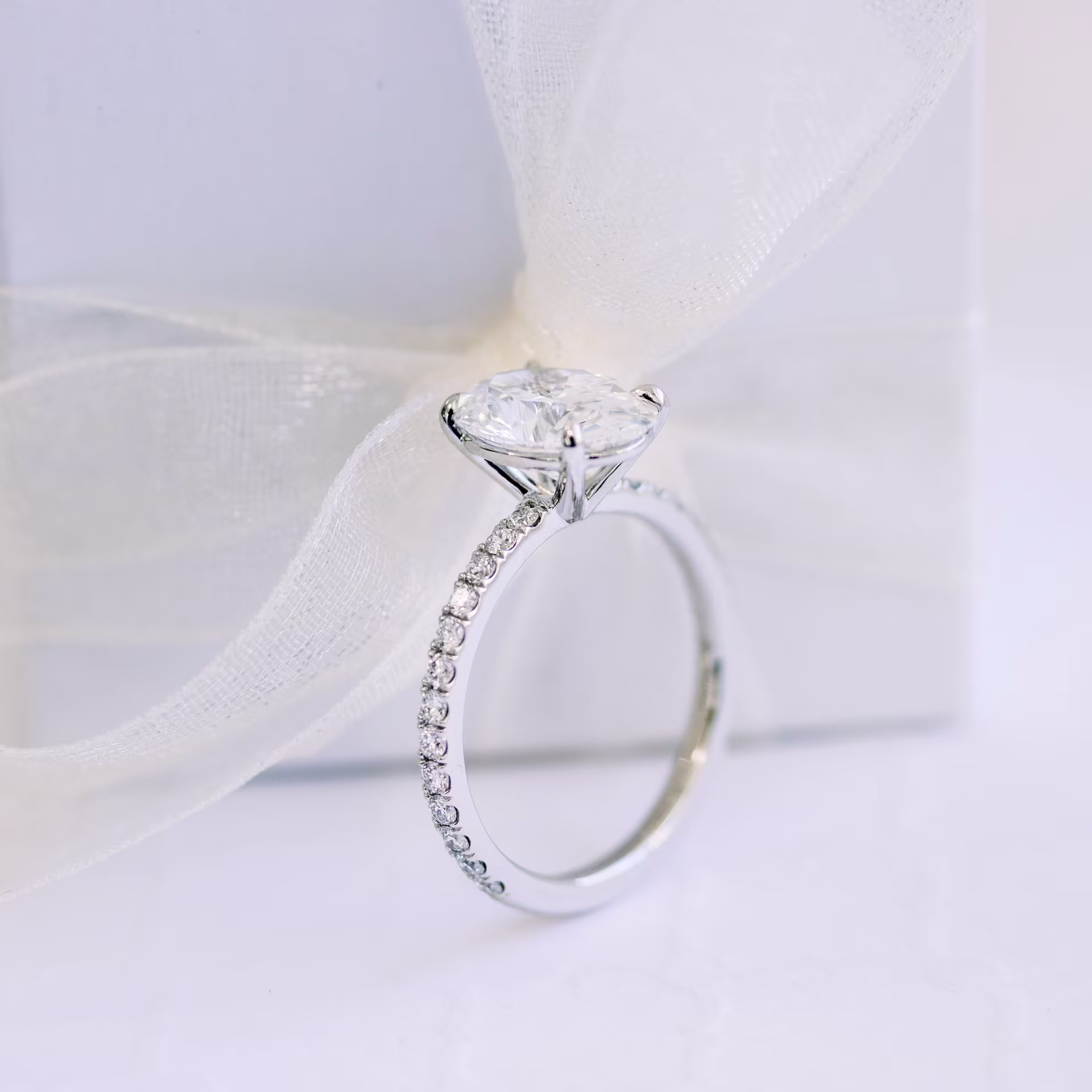 lab created oval diamond in pave setting in platinum